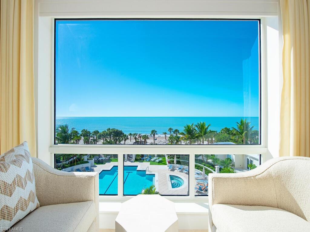 Experience elevated beachfront living in this beautifully furnished, elegantly remodeled, 3 bedroom plus den, 3.5 bath residence at The Biltmore at Bay Colony, Naples’ premier gated, private Gulf-front community. Offering panoramic Gulf views from three lanais, this spacious, reimagined residence showcases timeless marble flooring, a fully remodeled gourmet kitchen with high-end appliances, an exquisite master bedroom/bathroom, and elegant finishes and furnishings throughout directed by the skilled Godfrey Design Consultants. The versatile den features a custom built-in, TV and fireplace accent wall, while all bedrooms enjoy en-suite baths for comfort and privacy. Additional highlights include two under-building garage spaces, a climate-controlled storage unit with electric, and resort-style amenities: pool and spa, fitness center, sauna, social lounges, guest suites, and a newly renovated lobby with 24-hour front desk. Residents enjoy exclusive access to the Bay Colony Beach Club with fine dining and full-service beach concierge, plus Pelican Bay’s beach clubs, tennis, pickleball, wellness centers, and tram service. Minutes from Mercato, Waterside Shops, Venetian Village, and 5th Avenue South, this residence delivers exceptional luxury, lifestyle, and value on the Gulf of America. Ready for immediate enjoyment.