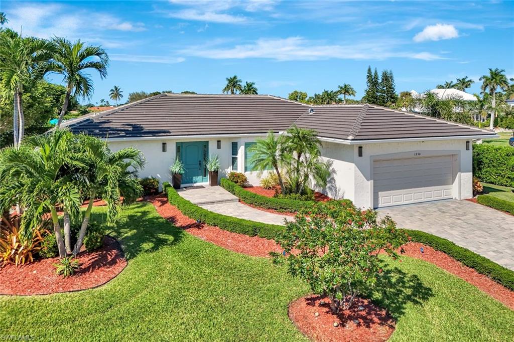 Back on market...Island home located on oversized corner lot.  A home where charm and elegance meet island living. Wood style tiled floors and a panoramic views of the pool greet you as you enter this 3-bedroom, 2-bath home. Located on a large corner lot, this stunning pocket of luxury, features an updated kitchen, with granite countertops and stainless-steel appliances. Imagine savoring your morning coffee on your private patio, overlooking a resort style, sloping beach pool, surrounded by beautiful green privacy hedges...or, on a cold night, sitting around the fire pit with friends and family enjoying a warm beverage. This home is a must see!