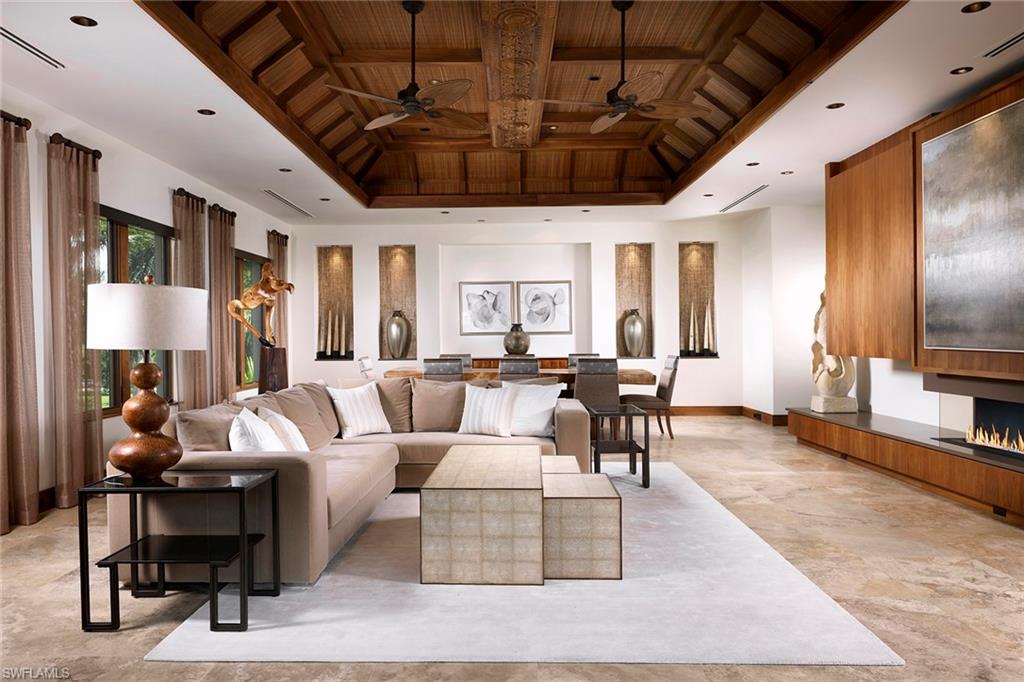 Ideally located one block to the beach and two blocks from Third Street, Namaste was designed to provide a calm and relaxing atmosphere to all. Offering quality craftsmanship and exquisite materials, the earthy and organic tones blend perfectly with the hand-selected Thai and Balinese finishes throughout.  The gourmet kitchen highlighted by the handmade tin water lily medallions from Thailand has a soft view of the lush greenery surrounding. Separated only by the custom gemstone Quartz and agate wet bar area lies the peaceful great room area surrounded by windows letting in the natural light. The tranquil master suite is a sanctuary, providing views through the western facing balcony and an airy place to unwind.  Truly one of a kind, the rooftop of this spectacular estate provides a great locale for family and friends to enjoy sunrises, sunsets over the Gulf or the occasional Naples firework show.  Not to be outdone, the southwest facing lanai includes a vanishing edge saltwater pool and a spacious covered area.  Beautifully surrounded by lush landscaping filled with fruit trees, coconut palms, orchids and jasmine flawlessly finish the experience that is Namaste.