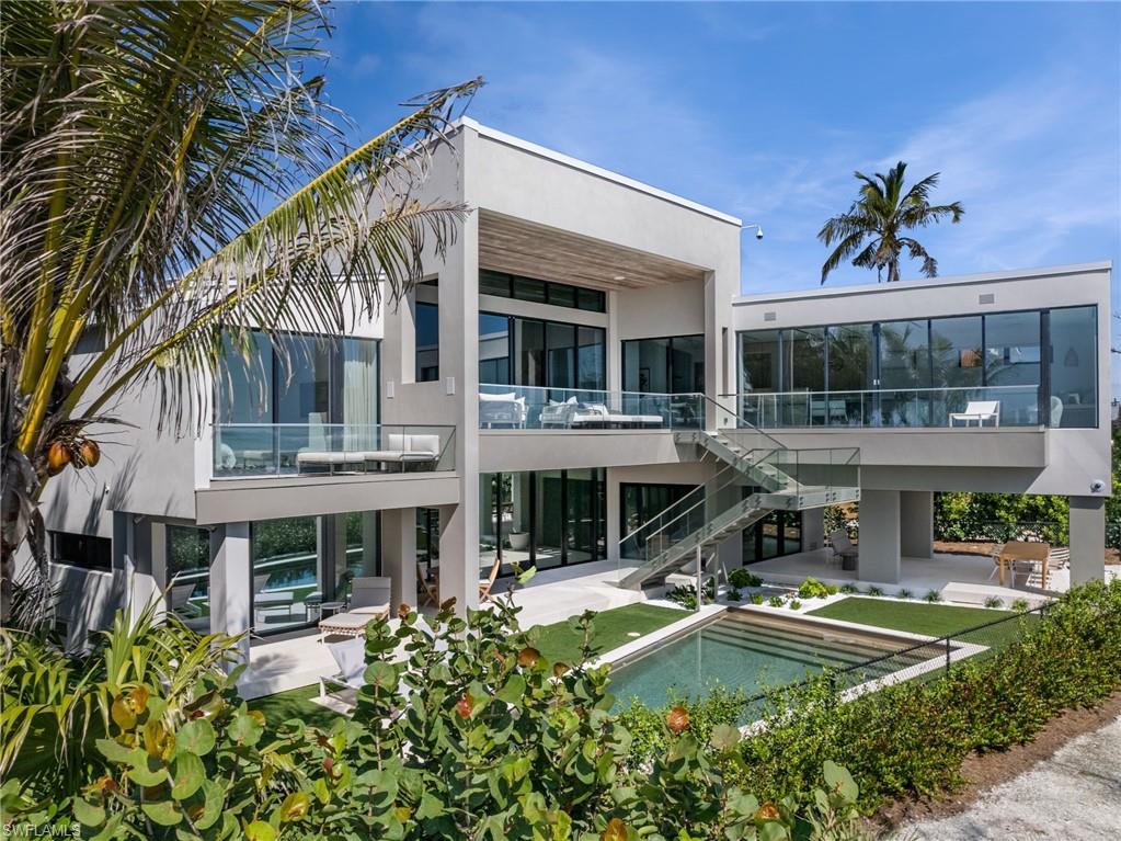 A True Beachfront Masterpiece on the Prestigious West Gulf Drive on Sanibel and Captiva islands that represents one of the most remarkable properties available. Created by the esteemed AJO Joyce Owen’s Architecture and completed in 2019, this modern island home sets a new standard in luxury and minimalist design, exceeding all expectations. With 5,475 square feet of air-conditioned living space and a total of 7,330 square feet of space dedicated to enjoyment, this residence stands out as a pinnacle of the Southwest Florida lifestyle . Key features and amenities include:- Siematic German kitchen cabinetry, Custom concrete countertops and sinks, Italian VIVA doors and hardware Duravit bathroom fixtures, Hand-blown glass lighting fixtures by John Pomp, Premium German and Italian furniture, Fleetwood & Eurowall windows and doors, Limestone flooring, an exquisite custom cantilevered metal and glass exterior staircase, Control 4 system for whole-house automated audio/video, A private driveway gate, and that's just the beginning. This home not only offers an unparalleled beachfront living experience but does so with an attention to detail and a level of design sophistication often seen on the shores of Naples and Miami Beach – and now – on Sanibel Island.
