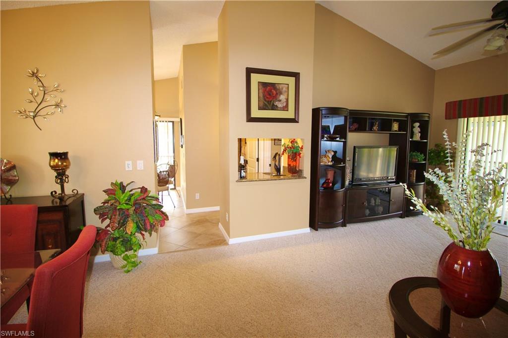 Welcome home to the sought after location of Caloosa Yacht  & Racquet Club community.  Wonderful quaint established community in South Fort Myers.  Close to the islands, Fort Myers Beach, shopping and located on the Caloosahatchee River. This end unit condo has high cathedral ceilings throughout with a large open Great Room and dining area. Wet bar for entertaining. This end unit offers two screened lanai's. Each condominium has private gated courtyard welcoming you into the front door.  Large screened lanai in back of home overlooks water with fountain and a separate screened lanai off of kitchen to enjoy your morning coffee.  Split bedroom living with updated bathrooms. Bedroom closets have custom built ins.  Kitchen is totally updated with granite countertops, tile/glass backsplash and stainless steel appliances.  Just bring your clothes.  Price includes EVERYTHING! Fully furnished throughout and fully stocked kitchen.  Full sized stacked washer and dryer.  Covered carport with additional storage unit conveys with property.  Owner has never lived condominium.  This unit was only used for family members visiting on vacation.  Community offers HUGE pool, tennis courts, pickleball courts, walking park with playground, wonderful marina with low slip fees available to homeowners located on the Caloosahatchee River and the community is  surrounded by Lake Spinnaker and awesome mature trees.  The upscale Blue Coyote supper club located in the Clubhouse is a private restaurant open only to community homeowners and private memberships outside of community.