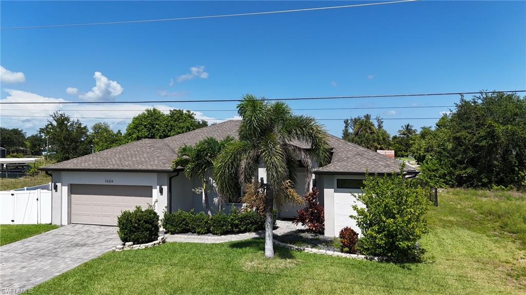 Beautiful 4 Bedroom home on Wide Open Freshwater Canal.  Modern Designed upgrades throughout.  Spacious Great Room floor plan with high ceilings, crown molding.  Double entry door into light and bright living area.  Tile flooring, Kitchen with 42 inch solid wood soft close cabinetry, granite counter tops, counter island, marble backsplash, and stainless appliances.  The large Primary Suite with sliders to patio, Huge primary bath with walk through shower and separate tub.  His and Her sinks with granite counters and walk in closets.   8 foot doors throughout as well as ventilated wood shelving in all closets.  Brick paved Driveway, Large patio overlooking Freshwater canal and Basin.  Fenced Yard, Upgraded security camera's installed.  Electric and Plumbing connections on patio for outdoor kitchen.  All Assessments Paid!  Garage has electric for EV hookup.  Close to everything.  Great SW location hurry make your showing today!