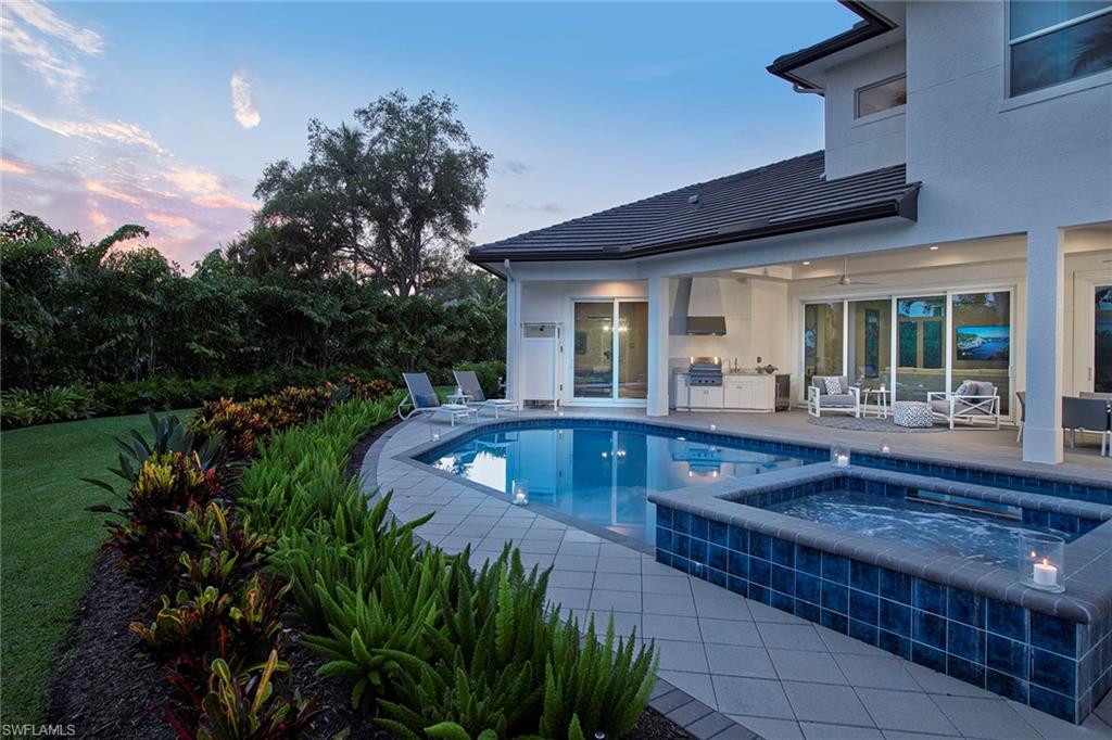 Southern-exposed and a short stroll from Lowdermilk Park, this coastal contemporary has location and style. Designed with natural light in mind, impact-resistant glass windows and sliders frame the entire home allowing for a light, bright atmosphere and views of the lushly landscaped backyard. Impressive 10-foot sliders pocket into the wall create an easily flowing space for entertaining with the kitchen, family room and covered lanai with summer kitchen connected seamlessly. The easy-living floor plan allows the utmost privacy to the master bedroom, which offers a calming space to unwind and a bath outfitted with dual sinks, soaking tub and amazing shower. The kitchen is truly a chef’s kitchen with a well-placed wall oven, large center island and lots of countertop space completed with quartz countertops. With five bedrooms plus a den, spacious backyard, covered lanai and plenty of extra parking areas, all of your friends and guests are sure to feel at home.