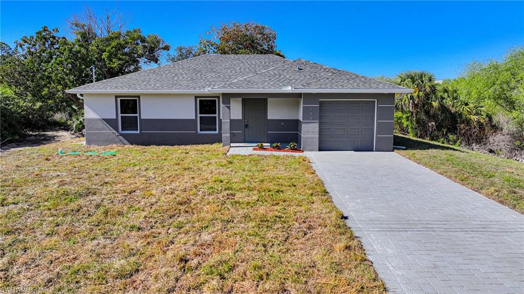 BRAND NEW CONSTRUCTION! You Will Be Amazed By The Quality Of This Brand New 3 Bedroom/2 Bathroom Home With Southern Exposure For Those Amazing Painted Florida Sunsets On A 1/4 Acre Lot In Lehigh Acres, FL. This Home Has 1258 SF Under Air And It Is COMPLETELY Finished With Its CO Issued! You Can Move Into It Today Or Use It As A Cash Flowing Rental Unit (High Demand). The Gourmet Kitchen Comes With Quartz Countertops, STAINLESS STEEL APPLIANCES, White Real Wood Shaker SOFT TOUCH Cabinet Doors & Drawers, Glass Tile Backsplash, Floor To Ceiling Pantry, And A Large Breakfast Bar. Other Upgrades Include; FREE BRAND NEW WASHER AND DRYER WITH PURCHASE OF THIS PROPERTY, HURRICANE IMPACT WINDOWS AND DOORS, Glass Back Door To Let In More LIGHT, Large Designer Porcelain Tile Flooring Throughout Entire Home, PAVER DRIVEWAY, High Ceilings, Large Living Room, Upgraded Baseboards, Large Dining Area, Custom Interior/Exterior Two-Tone Paint, Custom Ceiling Fans/Lights, Large Walk-In Closets, Quartz Countertops In The Bathrooms Along With Accent Tile Over The Tub Areas, New Landscaping Package With Old Growth Trees, Southern Exposure For Those Beautiful Florida Sunsets, Epoxy Coating In The Garage And On The Open Covered Lania, And A Laundry Area Including A New Washer And Dryer Inside The Home. This Home Is Close To Regional Shopping Malls, Golf Courses, Interstate I-75, Regional Airport, FGCU, Restaurants, Schools, Golf Courses, MLB Spring Training Baseball, Outdoor Parks, Boat Ramps, Amazing Fishing, And Those Amazing White Sand Beaches Of The Gulf Of America! The Photos And Tour Are From An Identical Home On A Different Lot.