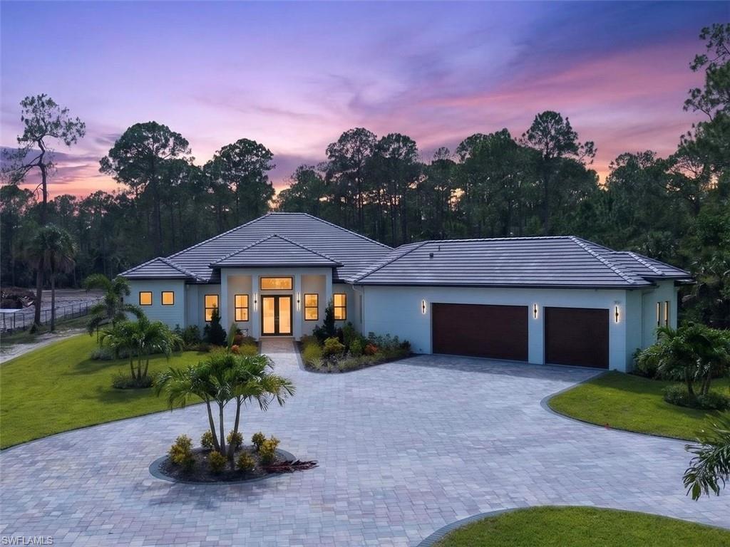 Situated on 2.5 acres of 100% upland in one of Naples' most desirable acreage areas. This exceptional New Construction Estate offers a rare blend of luxury, privacy, and convenience just minutes from Downtown Naples, world-class beaches, and everyday amenities, all without HOA restrictions. Thoughtfully designed with over 3,209 square feet under air, the residence offers 4 spacious bedrooms, a private office/den, 4 full bathrooms, and a powder room, complemented by soaring 12- and 13-foot ceilings, custom tray ceiling details, impact-resistant windows and doors, designer finishes, and expansive glass sliders that fill the home with natural light while creating seamless indoor-outdoor living. Designed for both everyday living and effortless entertaining, the chef's kitchen showcases custom cabinetry, quartz countertops, a waterfall island, pot filler, dual refrigerators, premium appliances, and a spacious walk-in pantry. The private owner's suite features two custom walk-in closets cabinetry, and a spa-inspired bath with dual vanities, a freestanding soaking tub, and an oversized walk-in shower with multiple shower heads. Each additional bedroom offers custom closet, and exceptional privacy, while the dedicated office provides an ideal space for working from home. The expansive screened lanai features shell stone decking designed to remain cool underfoot, an outdoor kitchen, heated saltwater pool and spa, outdoor shower, and multiple covered entertaining areas that effortlessly extend the home's living space year-round. Additional highlights include a fully fenced property with gate, oversized three-car garage, tile roof, two HVAC systems, pre-wired system with exterior surveillance cameras, integrated whole-home audio system, custom built-in cabinetry throughout, and irrigation system. A remarkable combination of luxury, privacy, and location, this residence offers the modern Naples lifestyle buyers have been waiting for.