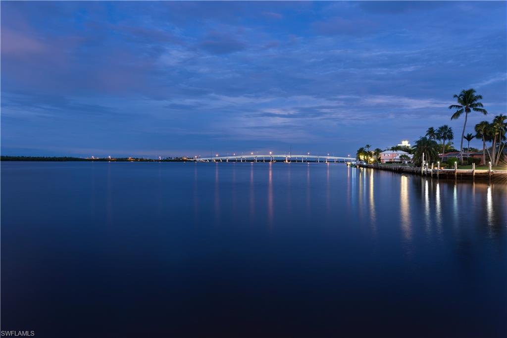 Extraordinary Opportunity! Direct access to Gulf, Breathtaking water views and sunsets from this Custom Designed Home.  Wrap around lanai with Infinity Edge pool/spa with outdoor entertaining area. Over 4600 square feet of living space,Three bedrooms and large Den, Gourmet kitchen with granite counters, custom cabinetry, stainless steel appliances and large pantry that joins laundry room area. Beautiful first floor primary bedroom with two large closets and spacious primary bathroom. The upper lever features a Bonus room with balcony, two Bedrooms.  Access the upper level observation deck off of the upper level Bonus room.This level features two large bedrooms with bathrooms and a Bonus room with kitchenette and large balcony with staircase leading to the observation deck. Extensive boat dockage, OVERSIZED three car garage with high ceilings & driveway with pavers. Brand new floating dock to accomodate 130 vessel.