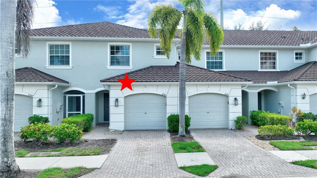 Welcome to 8585 Athena Ct, a well-maintained 2-bedroom, 2.5-bath townhouse located in the desirable gated community of Olympia Pointe in Lehigh Acres. The large loft can easily be used as the third bedroom. This spacious home features an attached garage, a comfortable two-story layout, and excellent access to both Fort Myers and I-75.  Inside, you’ll find bright living spaces, a functional kitchen, and two private bedroom suites upstairs. The back screened porch overlooks a peaceful area. The community offers resort-style amenities including a heated pool/spa, kiddie pool, fitness center, pool table, and tot lot, making it ideal for both full-time residents and seasonal owners. Centrally located near shopping, dining, and daily conveniences, this home delivers comfort, security, and convenience.  Check it out today and your search will be over.
