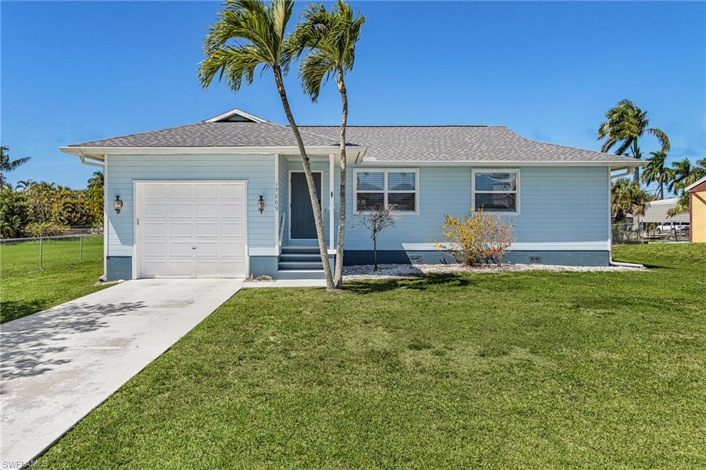 This charming 2-bedroom, 2-bathroom home is the perfect island getaway, offering a beautiful and comfortable space both inside and out. The interior features high cathedral ceilings that create an open, airy feel throughout the main living areas. You will love cooking in the modern kitchen, which comes complete with granite countertops, stainless steel appliances, and a convenient center island. The home is also move-in ready with important updates like a newer roof and a brand new tankless hot water heater. The outside of the property is just as inviting, sitting on a large, fenced-in lot that is perfect for enjoying the Florida sun. If you have a boat or an RV, there is plenty of extra parking space available on the property. Best of all, you are only steps away from the community boat ramp, giving you instant access to the incredible fishing and boating waters of Charlotte Harbor. Whether you are looking for a full-time residence or a peaceful vacation spot, this home is a beautiful find in a great location.
