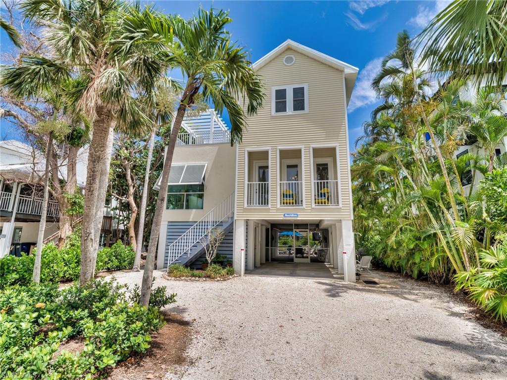 The popularity of this 3/3 Key West-style home, the Sun & Moon, may place it in the top tier of Captiva rental houses, with over 100 VRBO guests rating it exceptional.  It is easy to maintain and prepare for incoming guests.  Early 2026 advance reservations already total over $80,000.  The house is very well furnished and equipped for guest or owner's use.  The metal roof was replaced in 2020.  StormSmart installed new impact windows in 2021, and the heated pool has been resurfaced. To avoid disturbing guests, showing requests can only be approved on Saturdays between departing and incoming guests, with 12 to 2 pm suggested.  Closing date request is not before August 1, 2026. Future guest reservations must be honored.  Any advance or final rental payments for reservations shall be credited to the buyer at closing.