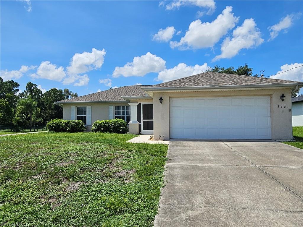 Welcome home to this beautifully maintained 3-bedroom, 2-bath residence situated on a desirable corner lot in Lehigh Acres. Featuring a spacious 2-car garage and a thoughtfully designed layout, this home offers comfort, functionality, and peace of mind. The roof was replaced in 2024 and comes with a 10-year craftsmanship warranty through Bedrock Roofing along with a 30-year GAF Manufacturing Warranty. The spacious primary suite features two closets and a custom extra-large walk-in shower, creating a private retreat you'll love. A built-in desk area in the hallway provides the perfect space for working from home, studying, or staying organized. Enjoy Florida living year-round from the custom screened-in lanai overlooking the fully fenced backyard with mature trees that provide shade and privacy. This home has been exceptionally cared for and is move-in ready, showcasing pride of ownership throughout. Conveniently located close to shopping, dining, schools, and major roadways, this property offers the perfect combination of comfort, character, and value.