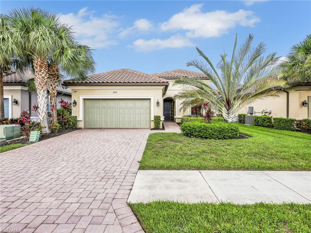 This beautifully maintained MOVE IN READY residence offers nearly 2,100 square feet under air with 2 bedrooms, a den, a separate office, 2 full bathrooms, 1 half bathroom, and a 2 car garage in the sought after natural gas community of Esplanade at Hacienda Lakes. With multiple flexible living spaces, the den and seperate office provide outstanding versatility and can easily accommodate a home office, hobby room, guest space, or even a potential third bedroom configuration.

Inside, high ceilings, crown molding throughout the living areas, lots of natural light, and tray ceilings in both the living room and primary suite create an open and inviting atmosphere. Tile flooring extends throughout the main living areas while the bedrooms feature carpet for added comfort. French doors lead to the den, providing privacy while maintaining natural light throughout the home.

The kitchen was designed for both everyday living and entertaining, featuring a large center island, tile backsplash, pantry, abundant 42’ solid wood cabinets, quartz countertops, GE Café Series appliances, and a natural gas range. The adjacent dining area overlooks the pool and lanai, while large sliding glass doors create a seamless connection between the indoor and outdoor living spaces.

The spacious primary suite offers a private retreat with a custom built walk in closet, tray ceiling, and a well appointed bathroom featuring dual sinks and a walk in shower with frameless glass enclosure. The guest bedroom enjoys the privacy of its own ensuite bathroom, making it ideal for visitors.

Outdoor living is where this home truly shines. The screened lanai features a pool surrounded by matching pavers that continue through the driveway, creating a cohesive and attractive exterior design. The large covered outdoor living area provides ample room for dining and relaxation and offers the perfect opportunity to add an outdoor kitchen. Additional deck space around the pool allows plenty of room for lounging and enjoying the Southwest Florida sunshine.

Additional features include accordion hurricane shutters, a tankless water heater, an inside laundry room, and thoughtful finishes throughout.

Residents of Esplanade at Hacienda Lakes enjoy a resort style lifestyle with a 6,500 square foot clubhouse, fitness center, resort pool and spa, resistance pool, tennis courts, pickleball courts, bocce courts, dog park, playground, social events, and numerous activities throughout the year. Conveniently located between Downtown Naples and Marco Island, the community offers easy access to beaches, shopping, dining, entertainment, and medical facilities.