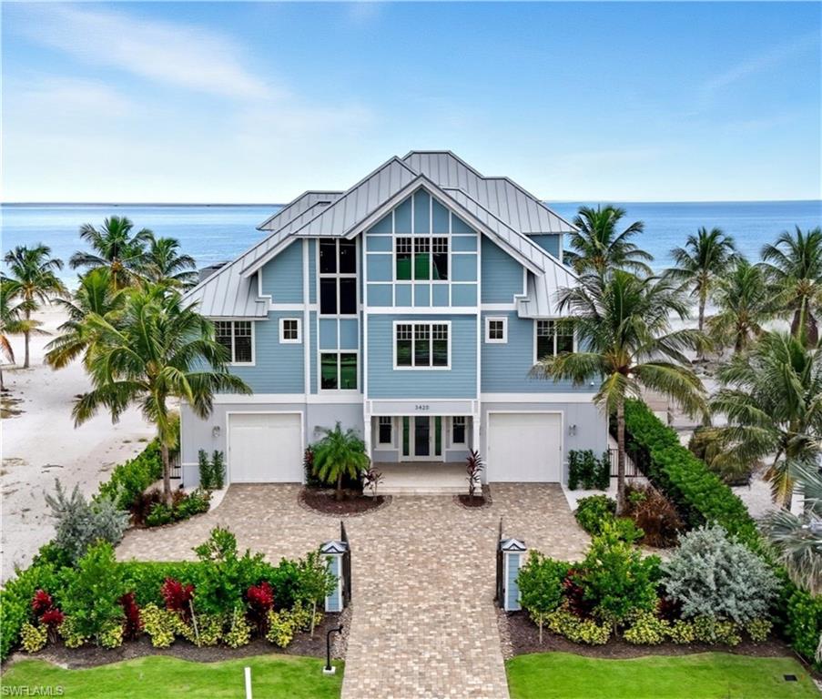 Gulf Front Glamour Meets Modern Sophistication!
Welcome to a Potter Homes masterpiece—an extraordinary three-story Gulf-front oasis where panoramic water views define every level. Designed with uncompromising craftsmanship, this residence is both a private retreat and an entertainer’s dream.
With five bedrooms, five and a half baths, plus a first-floor den, the home offers expansive open living spaces that blur the line between indoors and out. Multiple balconies frame the Gulf like living art, while the saltwater pool and spa create a private resort experience surrounded by swaying palms and endless shoreline.
The top-floor master suite redefines luxury with sweeping views, a private sitting room, wet bar with fridge, custom dressing room, spa-inspired bath, and exclusive balcony access. Thoughtful details such as a recessed TV cabinet and a second laundry area enhance both comfort and convenience. The four guest rooms include a luxurious main-level VIP guest retreat with serene Gulf views. Each guest bedroom features its own en-suite bath, providing privacy and comfort for visiting family and friends. 
Every finish has been intentionally curated—from sleek designer touches to refined architectural elements. Smart-home technology places control of gates, garage doors, security, cameras, Lutron lighting, HVAC, and pool heating in the palm of your hand, ensuring effortless arrivals. A whole-home Sonos system further enriches the living experience.
Perfectly located in a quiet residential neighborhood yet close to restaurants, Publix, and just a mile and a half from Times Square, the property offers the ultimate balance of tranquility and convenience.
This home embodies the pinnacle of coastal luxury—sophisticated, inviting, and unforgettable. It’s the ahhh moment every time you breathe in the salt air and take in the view…the view…the view.