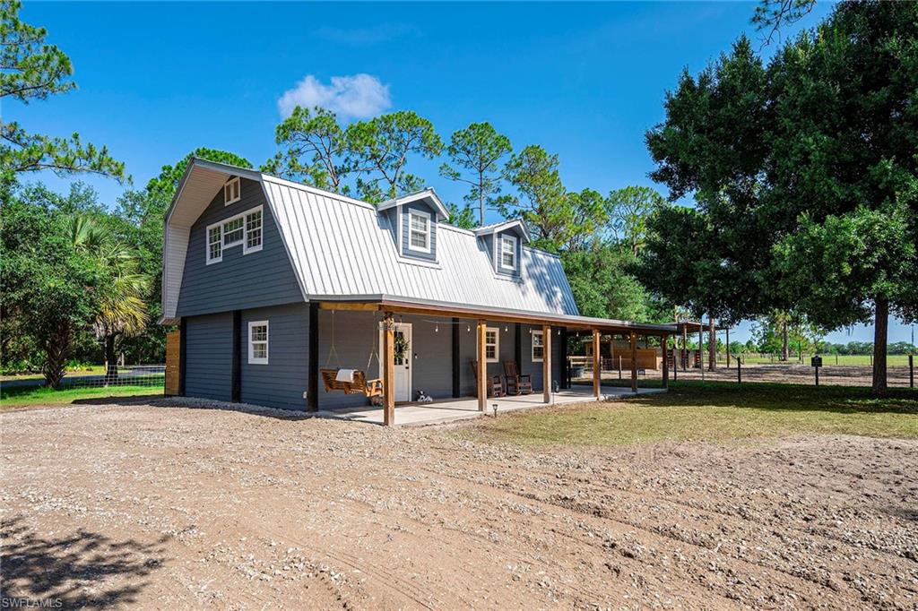 Country living on 2.3 fully fenced acres! Bring your horses, livestock and outdoor lifestyle to this move-in-ready property designed for comfort and functionality. The horse-ready barn features three stalls with adjustable configurations that can be expanded as needed, each with its water supply for convenient daily care. The barn is equipped with lighting throughout the stalls and dedicated tack and feed room, with wiring in place for fans. The tack room offers organized storage for saddles, bridles, equipment and barn supplies. Outside, the horse pasture is enclosed with electric fencing, and water service extends directly to the pasture and water troughs for easy livestock watering. An additional versatile stall provides space for goats, donkeys, miniature horses or other farm animals. The entire 2.3-acre property is fully fenced and secured with a gated entrance. Inside, you'll find a freshly painted interior, new flooring and bright, refreshed living spaces that create a clean, modern country feel. Durable tile flooring offers style and easy maintenance, while the whole-house reverse osmosis system adds an extra level of convenience and quality. Whether you're an equestrian enthusiast, hobby farmer or simply looking for room to roam, this property offers the ideal blend of rural charm and practical amenities.