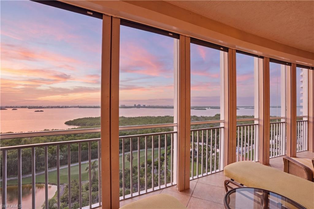Experience the VIEW of a lifetime from this exquisitely designed and highly esteemed 10th-floor “03” residence in Estancia at Bonita Bay. This luxury three-bedroom, three-bath home captures sweeping panoramic vistas of Estero Bay, the Gulf, the golf course, and the resort-style pool. From the moment you enter, the views captivate. The seamless architectural flow and uninterrupted scenery immediately set the tone for refined coastal living.
The living and dining areas feature gorgeous ceiling details and open effortlessly to the screened balcony, where spectacular views create the ideal setting for unforgettable sunsets every night of the year. A spacious family room also opens to the screened balcony, offering multiple gathering spaces designed for both entertaining and everyday comfort. The heart of the home, the kitchen, is both elegant and functional, featuring stainless steel Monogram appliances, an induction cooktop, and granite countertops. The kitchen opens to the breakfast nook and family room, all perfectly positioned to take advantage of natural light and breathtaking views.
The luxurious primary suite serves as a private retreat, featuring direct access to the screened balcony, two custom walk-in closets with wood shelving and built-in drawers, and a spacious ensuite bath. The spa-inspired bathroom includes separate sinks, a dedicated vanity area, a walk-in shower, and a soaking tub.
Two well-appointed guest suites are thoughtfully positioned for privacy. Both guest bedrooms offer direct access to an open-air balcony with eastern views of Bonita Bay and the golf course, and each features its own ensuite bathroom. This residence is further enhanced by electric hurricane shutters, BRAND-NEW impact windows (2026), fresh exterior paint (2026), and a new roof completed in 2024. These outstanding improvements offer peace of mind and long-term value. Three balconies, including screened and open-air spaces, provide exceptional outdoor living from nearly every room. Custom walk-in closets throughout complete the home with thoughtful storage and refined detail. Residents of Estancia enjoy resort-style amenities, including a pool and spa, fitness center, a social room, gas grills by the pool, two onsite guest suites, and onsite management. Beyond the building, Bonita Bay offers an unmatched coastal lifestyle with a private beach club, marina with waterfront dining, miles of walking and biking trails, kayaking and canoeing, multiple parks, and optional membership opportunities for five championship golf courses, tennis, pickleball, fitness facilities, and fine dining. Ideally located just minutes from Gulf beaches, world-class shopping and dining, Downtown Bonita Springs, Downtown Naples, and RSW Airport, this residence delivers the perfect balance of luxury, convenience, and elevated Southwest Florida living.