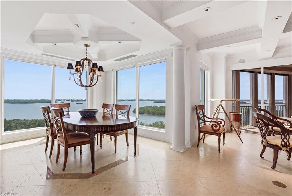 Experience the VIEW of a lifetime from this exquisitely designed and highly esteemed 10th-floor “03” residence in Estancia at Bonita Bay. This luxury three-bedroom, three-bath home captures sweeping panoramic vistas of Estero Bay, the Gulf, the golf course, and the resort-style pool. From the moment you enter, the views captivate. The seamless architectural flow and uninterrupted scenery immediately set the tone for refined coastal living.
The living and dining areas feature gorgeous ceiling details and open effortlessly to the screened balcony, where spectacular views create the ideal setting for unforgettable sunsets every night of the year. A spacious family room also opens to the screened balcony, offering multiple gathering spaces designed for both entertaining and everyday comfort. The heart of the home, the kitchen, is both elegant and functional, featuring stainless steel Monogram appliances, an induction cooktop, and granite countertops. The kitchen opens to the breakfast nook and family room, all perfectly positioned to take advantage of natural light and breathtaking views.
The luxurious primary suite serves as a private retreat, featuring direct access to the screened balcony, two custom walk-in closets with wood shelving and built-in drawers, and a spacious ensuite bath. The spa-inspired bathroom includes separate sinks, a dedicated vanity area, a walk-in shower, and a soaking tub.
Two well-appointed guest suites are thoughtfully positioned for privacy. Both guest bedrooms offer direct access to an open-air balcony with eastern views of Bonita Bay and the golf course, and each features its own ensuite bathroom. This residence is further enhanced by electric hurricane shutters, BRAND-NEW impact windows (2026), fresh exterior paint (2026), and a new roof completed in 2024. These outstanding improvements offer peace of mind and long-term value. Three balconies, including screened and open-air spaces, provide exceptional outdoor living from nearly every room. Custom walk-in closets throughout complete the home with thoughtful storage and refined detail. Residents of Estancia enjoy resort-style amenities, including a pool and spa, fitness center, a social room, gas grills by the pool, two onsite guest suites, and onsite management. Beyond the building, Bonita Bay offers an unmatched coastal lifestyle with a private beach club, marina with waterfront dining, miles of walking and biking trails, kayaking and canoeing, multiple parks, and optional membership opportunities for five championship golf courses, tennis, pickleball, fitness facilities, and fine dining. Ideally located just minutes from Gulf beaches, world-class shopping and dining, Downtown Bonita Springs, Downtown Naples, and RSW Airport, this residence delivers the perfect balance of luxury, convenience, and elevated Southwest Florida living.