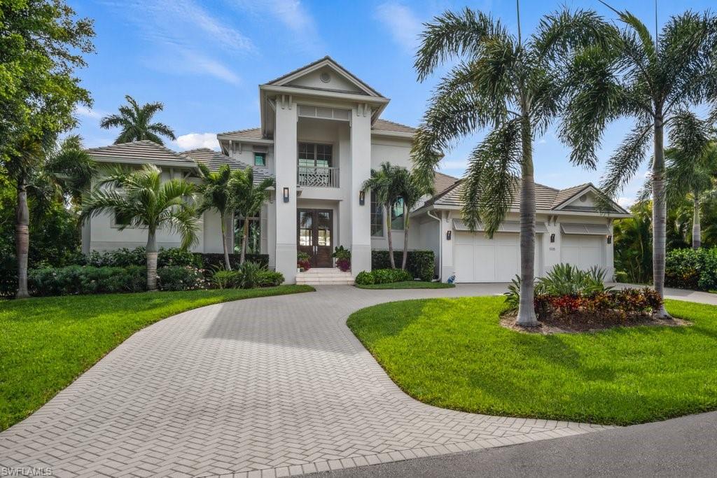 Prepare to be captivated by this custom built, thoughtfully designed Gulf access canal front home providing the waterfront lifestyle of your dreams. Located within the exclusive and highly desirable Seagate community, with a voluntary HOA which upon joining, provides access to the private beach club that is within walking distance, where you can enjoy the beach pavilion, BBQ grills, on site bathroom and showers, as well as private parking area on gorgeous Seagate beach. The home features Western rear exposure to enjoy beautiful Florida sunsets, is just under 4000 square feet with 4 bedrooms plus a den with 4 full and 2 half baths. You will fall in love with the custom designed saltwater pool overlooking the water. Custom upgrades abound, including a composite dock with a 7,000lb boatlift plus jet ski lifts, wire-brushed European white oak flooring throughout, custom closets, LED lighting, floor-to-ceiling sliders, gorgeous stonework surround fireplace in living area and another on the expansive patio, which is an entertainer's dream with a full outdoor kitchen for true indoor/outdoor living. Thermador appliances, wet bars upstairs and down, a private elevator, the list goes on!