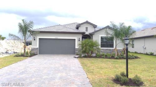 2019 construction situated on a premium water lot with an extended lanai and expansive outdoor space equipped with a private pool. Offered turnkey furnished! Inside this well cared for home you will find ample living space spanning across 3 bedrooms + Den and 3 baths. Upgrades and features need to be seen to be appreciated. To name a few; Plantation Shutters, Crown Moldings, Upgraded plank tile floor, White Shaker Cabinets, Solar heated pool.  This amenity rich community offers a resort-style pool with a waterfall & slide, 40-seat spa, splash park, restaurant & bar offering poolside seating, a playground, child care, dog park, basketball, fitness center, bocce, pickle-ball & tennis courts with pro shop, large pavilion, beach volleyball courts and a community trolley service!