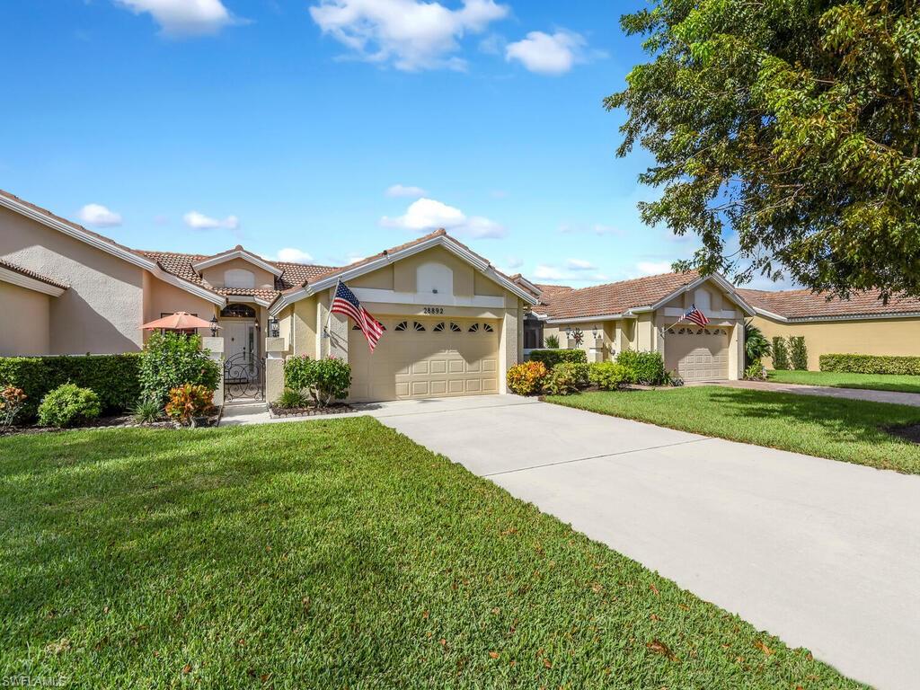 Living is easy here in this well maintained 3 bed 2 bath Hunters Ridge villa with views of the lake and the 9th fairway.*Charter Golf Membership included* Owner may choose on an annual basis to be a golf or social member. In this home the large open living space lends to plenty of room for entertaining, featuring a light and bright kitchen with a wet bar and the perfect amount of cabinets all alongside the living room with space for everyone. The master bedroom is complete with an ensuite bathroom with his and hers sinks.  Enjoy all Hunters Ridge has to offer including the beautiful golf course, tennis courts, a clubhouse, activity center, and a community pool with food and beverage services and so much more! Perfectly located near shopping, dining, and entertainment, and best of all only 6 miles to the beautiful Barefoot Beach Preserves.