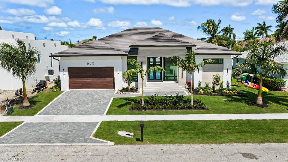 Experience refined coastal living in this luxury residence crafted by Werning Construction, built with the precision and sophistication that define Marco Island’s premier waterfront homes.



Spanning 2,651 square feet under air (3,681 total under roof) this 4-bedroom, 3.5-bath home balances contemporary design with relaxed island elegance. A grand corner glass entry welcomes you into an open-concept layout filled with natural light, 10 foot sliding doors, and custom finishes throughout.



The chef’s kitchen features premium thermador appliances, sleek custom cabinetry, hidden pantry, and an oversized island perfect for entertaining. The great room flows seamlessly to the outdoor living space—complete with a summer kitchen, fully automated pool with high end finishes. Tranquil water views that capture the essence of Southwest Florida living. Home will have a whole house generator and garage a/c. 



The primary suite is a true retreat with a spa-inspired bath, walk-in shower, and designer details that elevate everyday comfort. Three additional guest rooms offer space and privacy for family or visitors.



Located just moments from Marco Island’s beaches, fine dining, and world-class boating - direct access location just a few minute idle out to open water. 



630 Bimini embodies luxury coastal craftsmanship—built to impress, designed to last.