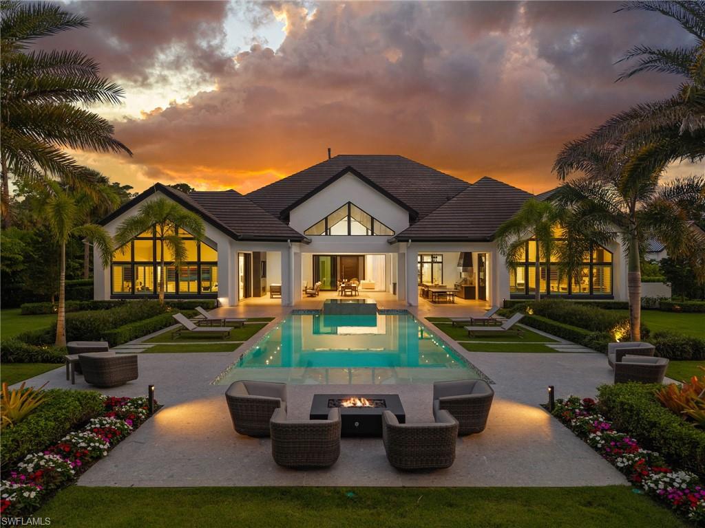 Welcome to Coach House Lane, a Gated residence celebrated for its luxury and privacy. This fully furnished estate sits on 2.58 acres of meticulously landscaped grounds with no HOA restrictions and offers over 7,200 sq. ft. of expansive single-level living.

Designed for those who appreciate both comfort and sophistication, the home features a chef’s kitchen with Wolf, Sub-Zero, and Miele appliances, a fully equipped prep kitchen/butler’s pantry, bar and game room, dedicated media/entertainment room, private study, and a custom temperature-controlled walk-in wine room. The residence is enhanced by a Control4 Smart Home Automation system, providing seamless control of lighting, climate, entertainment, and security throughout.

The sprawling backyard offers the ultimate retreat with a resort-style pool and spa, firepit, and a spacious lanai with fireplace and bar area—perfect for entertaining and relaxing. A professional lighted putting green with two hitting stations overlooks the pool, and there’s ample room to add a tennis/pickleball court or guest house.

Car enthusiasts will love the six-car, air-conditioned garage with soaring ceilings that can accommodate up to 12 vehicles, while the whole-house generator ensures uninterrupted comfort and convenience.

The primary suite serves as a true sanctuary, offering a sitting area, morning bar, media room, spa-like bath, with a steam shower featuring integrated Bluetooth audio, and dual walk-in closets — including a luxurious dressing room with its own washer/dryer and steamer. Each en-suite guest bedroom provides a private, elegant retreat for family and friends.

Surrounded by world-class golf courses including Royal Poinciana and Grey Oaks. Located just minutes from Naples Private Airport, 5th avenue, downtown Naples and World Renowned Beaches .  This remarkable property perfectly combines modern technology, refined design, and resort-style living.