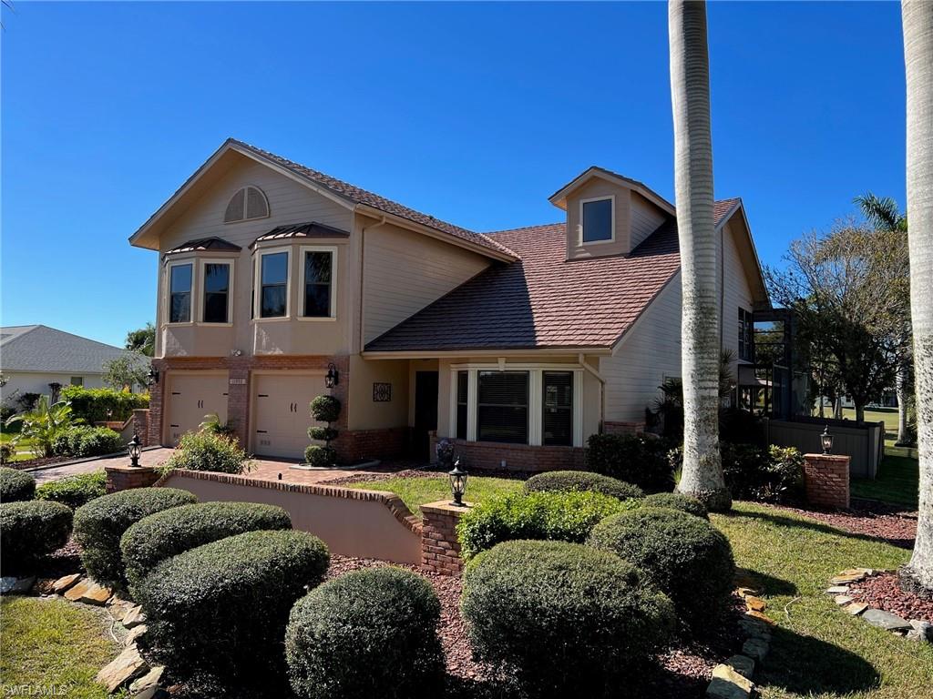 A must-see home located in the beautiful Cape Royal community. This gated community offers one of the most sought-after developments in SW FL with golf, driving range, putting green, pro shop, Clubhouse, Restaurant, Bar, Tennis and Pickle ball Ct. This golfer’s dream home is situated on the 5th green with beautiful views of the course. The home offers a large lanai and pool area overlooking the Cape Royal golf course. The outside space is the perfect place to entertain or relax. The home offers 3 bedrooms, 2.5 baths and over 2,700 sq ft of living area. This floor plan lives very comfortably and is ideal for entertaining. With an oversized 2 car garage that includes a separate side entrance for a golf cart, and storage space is plentiful. The huge upstairs master suite offers beautiful wood floors, tons of closet space and a large master bath. Relax on the second floor outside of your master bedroom in the screened area overlooking the golf course. Many new updates include recently renovated kitchen and bathrooms, tile flooring in living area, a complete CPVC re-pipe (2021), new pool pumps, new HVAC system and much more. The best part is the low HOA fees of under $120.00/month.