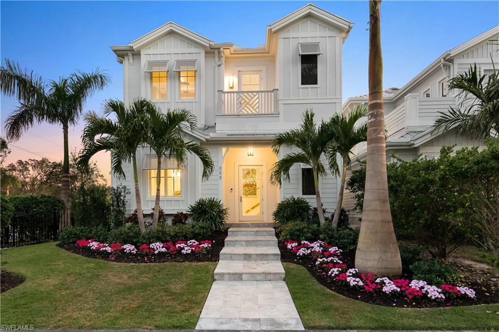 NEW Construction Olde Naples now ready for Immediate Occupancy.  This two story Coastal styled home located at 888 10th Ave S. The home features four bedrooms in the main house and a separate private guest suite above the garage. This spacious floor plan can easily accommodate a large family as well as your guests. Many of the stunning features of this home include 11 foot ceilings, Legno Bastone Flooring, UMI quartz countertops, Thermador Professional Series Kitchen appliances. Generous master bedroom suites and laundry facilities are located on both the first and second floors. This Olde Naples home has been perfectly designed for family, friends, and entertaining alike. The generous outdoor living space includes an outdoor kitchen that has a grilling area, a gas fireplace, retractable screens and sundeck which wraps the beautiful pool and raised spa. Three additional balconies provide some views of Naples Bay as well as the surrounding area and add additional space to this already fabulous floor plan. Located in truly one of the best areas in Olde Naples. From here, one can easily walk a few short blocks to Historic 5th Ave, 3rd Street S,The City Dock and Tin City.
