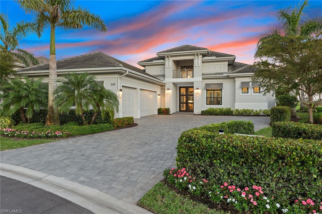 Treat yourself to high-quality upgrades and fantastic golf course views, as far as the eye can see, offered in this over 3,000-square-foot dream home set on a cul-de-sac in the award-winning community of Fiddler's Creek! Pass through impressive doors to discover an impeccably maintained open-concept interior with four bedrooms plus study and four-and-a-half baths. Coffered ceilings, sophisticated lighting, custom window treatments, and impact-resistant doors and windows that frame golf course views lend a timeless elegance. Your gourmet kitchen has stainless steel appliances, gas cooking, a wine fridge and a large island. Oversized primary suite features dual walk-in closets, outdoor access and an elegant bath with a soaking tub. Take advantage of the southeast exposure from your screened-in lanai where remote-operated awnings keep you comfortable. With a saltwater pool and spa, outdoor kitchen, and a fire table, what's not to love? Other perks include an air-conditioned three-car garage with an exercise area, office with custom cabinetry and doors, electric shutters, Sonos surround sound, and video camera system. Fantastic community amenities; loads of activities. Golf, beach and marina memberships available.