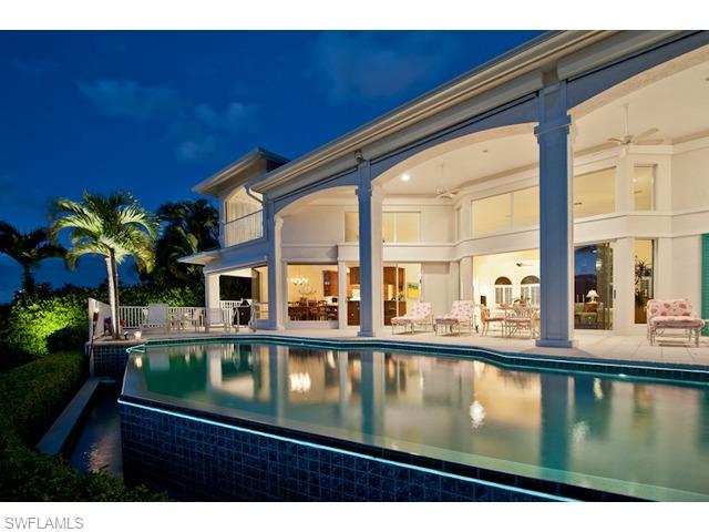 Ideally situated with wide western views overlooking Venetian Bay, this lovely home in Park Shore provides homeowners and their guests the ultimate in relaxation. The open floor plan is designed to provide pristine views from nearly every room. A stylish great room serves as the epicenter of the home and features a wet bar and fireplace. The large lanai with an outdoor fireplace, pool and spa creates a tranquil venue for entertaining while enjoying the beautiful Naples sunsets. Boaters will enjoy more than 100 feet of water frontage and a boat dock with lift providing easy access to the Gulf of Mexico. Private beach access is available for Park Shore residents.