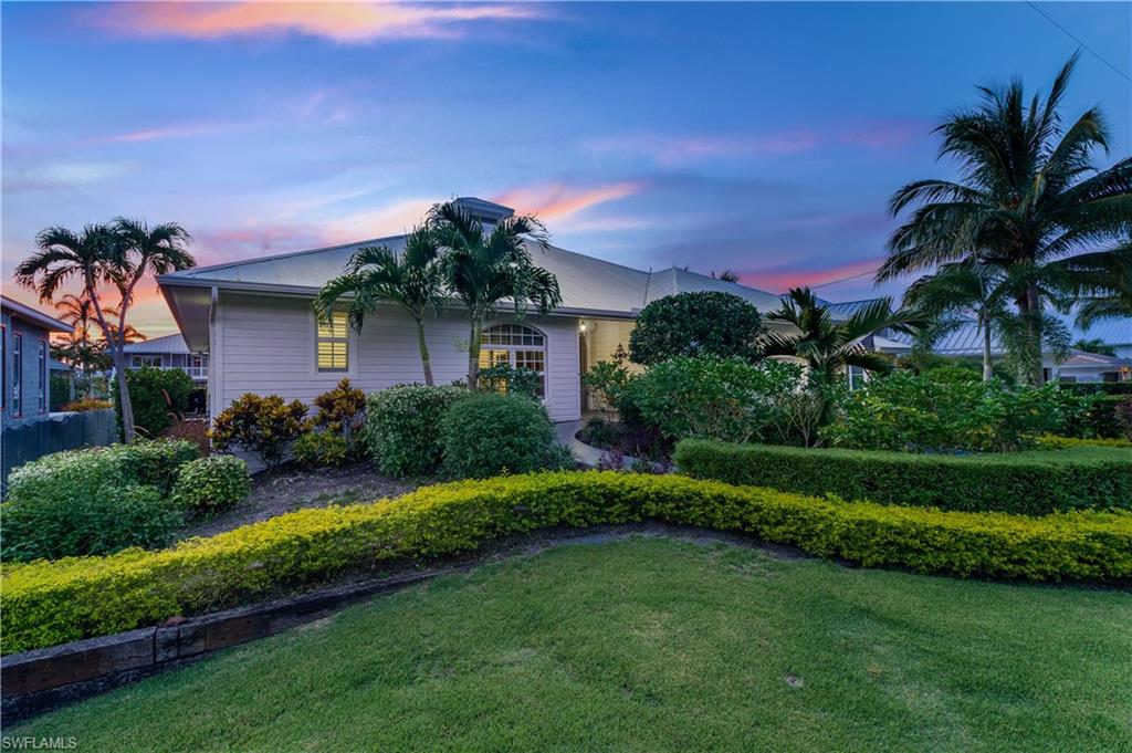Lives like brand new construction!! Complete renovation on this stunning waterfront property. Home offers an immediate water/pool view as you enter large oak front doors. Walk into a large open floor-plan with vaulted tray ceilings & new Cabana Sand Italian ceramic tile flooring throughout the entire house. Brand new kitchen upgrades include White Glacier countertops, white cabinetry-to ceiling w glass fronts, new gas stove/gas range, new hood over range, new microwave installed into large island 8ft X 5ft, white/grey Granite Countertops, & dark grey cabinetry. Set foot into your new master bedroom suite with massive walk-in custom closets. Master bath upgrades include white/grey granite, White Shaker Cabinets, new stand-alone tub, Brush nickel fixtures, etc. Enjoy the sun-drenched back lanai with a heated pool & waterfall feature. Huge outdoor living space with lemon/orange trees. Boaters will appreciate the like-new boat dock/lift & quick no-bridge access to Naples Bay & Gulf of Mexico. Within a couple of miles to 5th Avenue South for shopping/fine dining & Naples white sandy beaches. Don't miss your chance to live in one of Naples most desirable waterfront communities