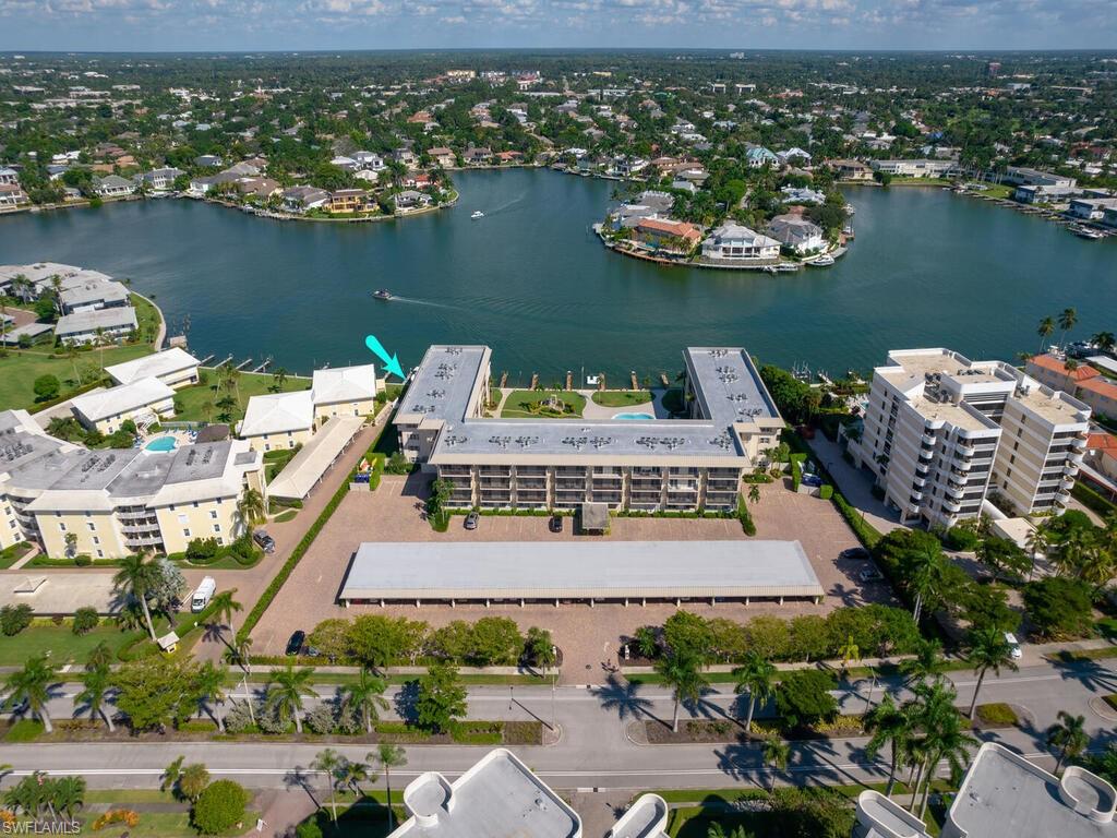 Enjoy your morning coffee overlooking the Moorings Bay!
This 2 bedroom 2 bathroom condo is located on the fourth floor with wonderful views over the pool area and Moorings Bay. This condo has a deeded carport space and storage locker. Coquina Club is beautifully maintained and enjoys wonderful landscaped grounds and leased boat docks. Enjoy time by the pool overlooking the bay or relax on the dockside seating areas.