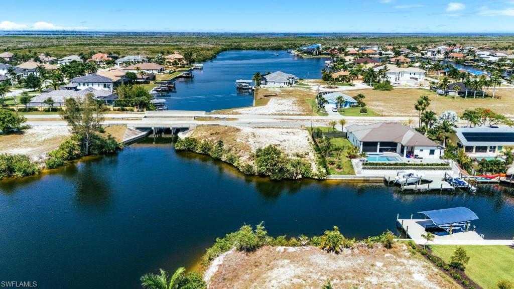 PARADISE FOUND !!!! GULF ACCESS LOT WITH EASTERN EXPOSURE AND WIDE INTERSECTING CANAL VIEW !!!! Up to 200 FEET OF WATER FRONTAGE AND 200 FEET OF CAPTAINS WALK CAN BE INSTALLED PLUS MULTIPLE BOAT LIFTS.   LOCATED IN NW CAPE CORAL IN AN AREA OF NEWER HOMES WITH THE UPCOMING 7 ISLANDS PROJECT AND THE NEW CITY PARK, OPENING MAY 29th 2026!!! AND JUST A SHORT BOAT RIDE TO MATLACHA WITH QUICK ACCESS TO CAYO COSTA, BOCA GRAND, CAPTIVA ISLAND, SANIBEL ISLAND, PINE ISLAND AND MORE. OPTION TO QUIT CLAIM WITH THE CITY FOR ADDITIONAL LAND AROUND 5000 SQUARE FEET MAKING THIS A TRIPLE LOT AT NO COST !!! DON’T MISS OUT ON THIS DEEP, WATER FRONT, DIRECT ACCESS, BOATING FRIENDLY, FISH LOVING, TARPON ROLLING, EXCELLENT SUNRISE-SUNSETTING PERFECT LOCATION. CALL TODAY TO MAKE IT YOURS!!