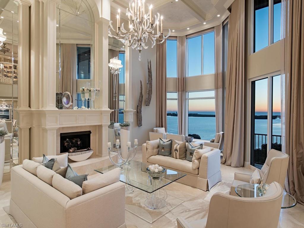 This magnificent 2-story open floor plan penthouse sits atop Palermo, an elegant tower at the Colony Golf & Bay Club. Designed by Kira Krümm Interior Design this fully furnished home with 5 bedrooms, 5.5 baths and over 7000 total SF, combines transitional and coastal styles, into a serene, chic and sophisticated masterpiece. Neutral backgrounds with color and texture reserved for the accents create a peaceful palette that frame the incredible views of the Gulf. The two story great room, featured on the cover of Florida Home and Design, is of a grand scale with a mirror-flanked fireplace, dazzling crystal chandelier and rich fabrics in creams and subtle blues. The Chef’s kitchen features a commercial gas range, 2 dishwashers and opens to a comfortable family room and breakfast area with custom banquette. A study and downstairs guest room completes this level. An open marble staircase brings you to the 2nd level with opulent master bedroom suite complete with private sitting area and spa type bath with steam shower and two additional guest rooms. This home features a private two-car garage with storage room. Colony amenities include Bay Club dining and boat access to private beach.