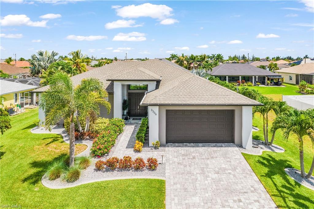 Welcome to this beautifully furnished pool home offering 4 bedrooms, 3 full bathrooms, and over 2,000 square feet located in Southwest Cape Coral. This home has a spacious kitchen featuring granite countertops, stainless steel appliances, a large center island, and abundant storage. Valted ceilings, 8-foot interior doors, and plank tile flooring throughout the main living areas create a bright, elegant atmosphere. The primary suite offers a spa-inspired bath with a freestanding soaking tub, frameless glass shower, and a generous walk-in closets.

Step outside to your oversized screened lanai featuring a stunning pool and expansive paver deck, creating the perfect setting for relaxing or entertaining year-round. Beyond the lanai, an additional backyard patio provides even more outdoor living space for grilling, gathering with friends, or enjoying the Florida sunshine. A convenient pool bath, paver driveway, irrigation system, professionally landscaped yard, and two-car garage complete the home's impressive features.

Ideally located near shopping, dining, and schools, this home is also just minutes from four of Cape Coral's most popular parks: Tropicana Park, Joe Stonis Park, Jim Jeffers Park, and Sirenia Vista Park, offering playgrounds, walking paths, sports facilities, pickleball, tennis, and kayaking opportunities. With easy access to the Burnt Store Boat Ramp and Pine Island, this move-in-ready home delivers the very best of the Southwest Florida lifestyle.