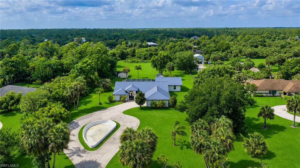 MORE SPACE, PEACE & POSSIBILITIES! This Exceptional Home, situated on 2.5 fully cleared and fenced acres in Golden Gate Estates, offers the perfect blend of comfort, flexibility, and country living. Encompassing approximately 3,300 square feet, the residence features 5 bedrooms and 4.5 bathrooms, including a private in-law suite complete with its own living room, kitchen, bedroom, and full bath—ideal for multigenerational living, extended guests, housekeeper, in-home nursing care or private accommodations.
Designed for both relaxation and entertaining, the outdoor living area boasts a sparkling pool, soothing spa, expansive paved driveway, 2-car garage, storage shed, and abundant open space to accommodate your hobbies, recreational vehicles, animals, or future additions.
Built with peace of mind in mind, the home is equipped with a durable metal roof, impact-resistant windows and doors, a whole-house water treatment and reverse osmosis system, and is located in an X Flood Zone, eliminating the need for most lenders' flood insurance requirements.
Offering the rare combination of acreage, privacy, and modern conveniences, this is a unique opportunity to enjoy the freedom and lifestyle that Golden Gate Estates is known for while remaining just minutes from Naples' shopping, dining, schools, and Gulf beaches.