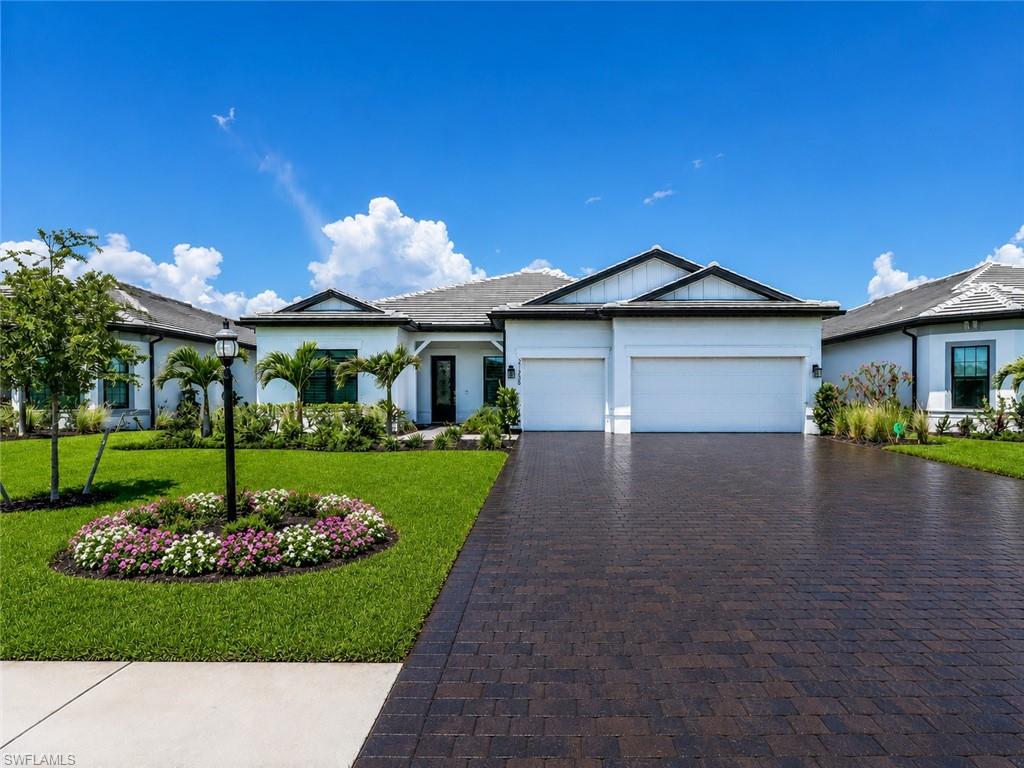 Experience the best of Southwest Florida living in this exceptional 3-bedroom plus den, 3-bath residence offering 2,482 square feet of beautifully designed living space in the highly sought-after community of Verdana Village. From the moment you step inside, you’re welcomed by an expansive, light-filled great room featuring elegant tray ceilings and dramatic zero-corner sliding glass doors that create a seamless transition between indoor and outdoor living. Captivating views of the sparkling pool, spa, and tranquil lake provide a stunning backdrop and set the tone for the relaxed Florida lifestyle this home was designed to offer. At the heart of the home, the gourmet kitchen is both stylish and functional, featuring an oversized island with breakfast bar seating, gas cooktop, wall oven, abundant cabinetry, spacious walk-in pantry, and an expansive dining area ideal for entertaining family and friends. The luxurious owner’s suite offers a private retreat complete with a spa-inspired en-suite bath featuring dual vanities, a soaking tub, walk-in shower, and generous walk-in closet. Two additional guest bedrooms provide comfort and privacy for family and visitors, while the versatile den is perfectly suited for a home office, media room, or additional guest accommodations. Step outside to your own private Florida oasis. The expansive outdoor living area is designed for year-round enjoyment, featuring a sparkling pool and spa overlooking the peaceful lake and a fully equipped outdoor kitchen with built-in grill—perfect for relaxing, dining, and entertaining. Verdana Village offers an unparalleled resort-style lifestyle with an impressive collection of amenities, including its one-of-a-kind indoor sports complex featuring pickleball, tennis, and basketball courts, as well as additional outdoor sports courts, a resort-style pool and spa, indoor and poolside dining, state-of-the-art fitness facilities, and endless opportunities for recreation and relaxation. Ideally located just minutes from shopping, dining, Southwest Florida International Airport, I-75, and Southwest Florida’s beautiful white-sand beaches, this extraordinary residence offers the perfect combination of luxury, lifestyle, and location. Schedule your private showing today and experience everything this exceptional Verdana Village home has to offer.