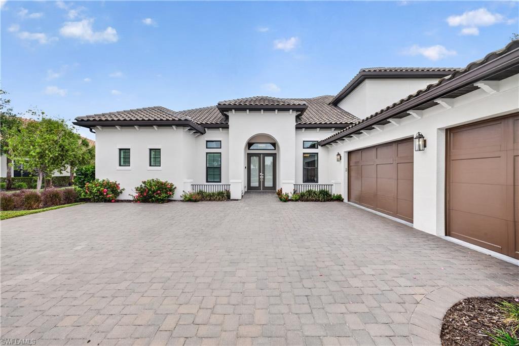 Welcome to 8709 Cavano Street, an exceptional residence located in the highly sought-after gated community of Esplanade Golf & Country Club in Naples. Full Golf Membership. Newest home in the community. Built in 2022. New Beacon Model. Loaded with upgrades. Some of which include an indoor fireplace with bookcase, engineered hardwood floors throughout the main level of living, primary bedroom and upstairs loft area,  an outdoor fireplace. Outdoor kitchen with pool and spa and highly upgraded pavers. Perfectly blending luxury, comfort, and the ultimate Southwest Florida lifestyle, this beautifully appointed home offers refined indoor-outdoor living in one of Naples’ premier resort-style communities.

This home is being offered Turnkey Furnished which was completed with high end furniture both inside and out! Step inside to discover an open and airy floor plan filled with natural light, elegant finishes, and sophisticated design details throughout. The spacious living areas flow seamlessly into a gourmet kitchen featuring premium cabinetry, quartz countertops, stainless steel appliances, a large center island, and generous entertaining space ideal for hosting family and friends.

The luxurious primary suite serves as a private retreat with spa-inspired bath accommodations, dual vanities, an oversized walk-in shower, and expansive closet space. Additional guest bedrooms and flexible living areas provide comfort and privacy for visitors while allowing room for a den, office, or media space.

Outdoor living is truly exceptional, with a screened lanai designed to embrace the Florida lifestyle. Enjoy peaceful water and lush tropical views while relaxing by the pool and spa, dining al fresco, or entertaining in the spacious covered outdoor living area.

Residents of Esplanade Golf & Country Club enjoy world-class amenities including an 18-hole championship golf course, resort-style pool, tennis, pickleball, fitness center, walking trails, spa services, fine dining, Bahama Bar, and an active social lifestyle.

Ideally located just minutes from Naples’ renowned beaches, shopping, dining, and entertainment, 8709 Cavano Street offers the perfect opportunity to experience luxury resort living at its finest.