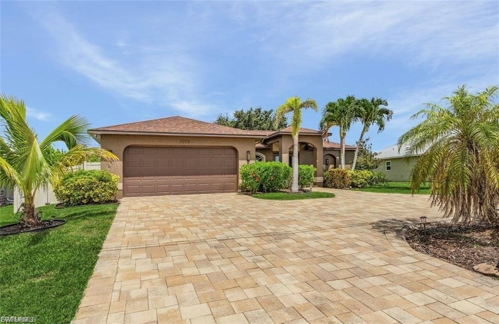 Stunning 3 bed, 2 bath home with 2-car garage in desirable SW Cape Coral. Features include a vaulted ceiling, lush landscaping, oversized paver circular driveway, and a fully fenced backyard. Enjoy a resort-style Pebble Tec pool and spa with marble waterfall and LED lighting. Recent updates include new exterior paint and lighting. Available fully furnished. Close to Cape Harbour, shopping, dining, and schools.