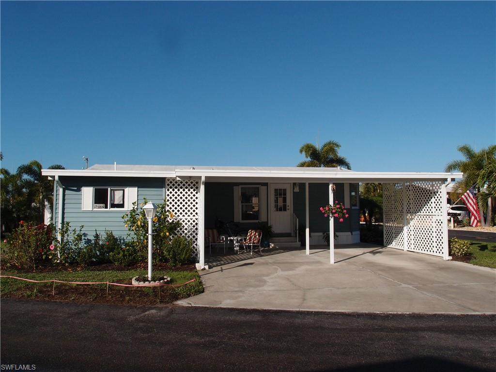 Well maintained bright and airy furnished home in a gulf access community with many amenities. This home features a corner landscaped lot with fruit and palm trees, an enclosed sun porch, an outside patio, large shaded carport and an additional enclosed storage area or workshop. Inside it offers an open floor plan, separate dining area off the kitchen with built in cabinetry and a desk, breakfast bar and a large master shower. The community has gulf access via a community boat ramp, pool and spa, bocce ball, pickleball, shuffleboard, fishing and a community center.