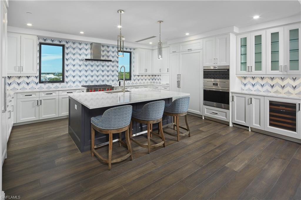 In the heart of the up-and-coming Naples Design District, Quattro at Naples Square offers the location, amenities, and community you have been looking for.  Perched on the penthouse level, #508 is a 4 bedroom plus den layout with southern views of the lush courtyard and countless upgrades that even the most discerning of buyers will appreciate.  The well-designed kitchen with Quartzite countertops and marble backsplash offers not only an abundance of space to work and gather but also a 36’ Wolfe gas cooktop with matching hood, oven and microwave, stand-alone Sub-Zero ice maker and so much more.  The primary suite is exceptionally spacious and has 2 walk-in closets, light and bright bath, and direct access to the south facing balcony. The easy flowing floor plan creates a perfect space for all, 2 open air balconies and is topped off with wiring for electric shades, TV housing in place, decorative and stylish light fixtures, upgraded shower fixtures, commodes and so much more.  This brand new, never lived in unit in Quattro is the perfect place to call your Naples home.