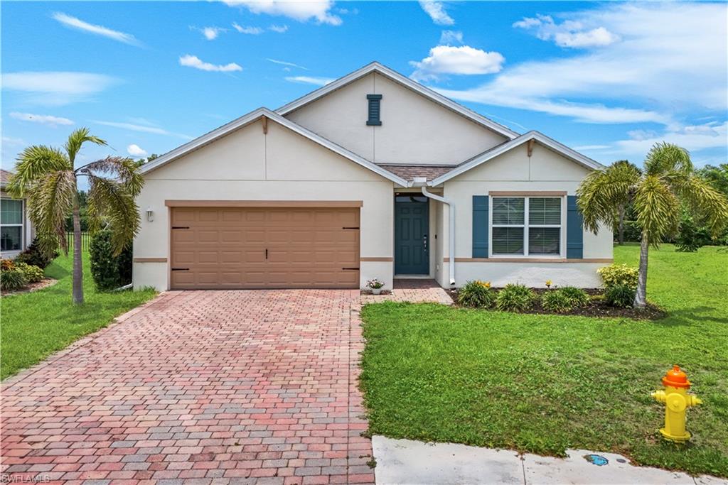 Welcome to the beautiful CALI FLOOR PLAN HOME ... BUILT IN 2020 ... Enjoy Florida living in this IMPECCABLY maintained home featuring 4 bedrooms, 2 full bathrooms.   This stunning home has upgraded fans & light fixtures. The sliding glass door opens up to the AMAZING, peaceful lanai and extra large outdoor space for the best outdoor entertaining!  The interior features tile flooring throughout the the main living area of the home. Inside the great room invites natural light and seamless indoor-outdoor living. The gourmet kitchen showcases beautiful stone countertops, a spacious center island, ample prep space and a large walk-in pantry. The primary suite is a private retreat with a walk-in closet, separate full closet, dual sinks, and a walk-in shower.   The dining room, offers tranquil views of the expansive lanai.  A 2 car garage with space for 4 cars on the brick-paver driveway provide ample parking and storage. Set on an expansive homesite, this residence blends privacy with proximity to the best of Southwest Florida. Entrada Subdivision hosts an amazing pool, club house, play area, tennis, pickle ball, lap pool, gym, and much more!!  Experience unparalleled luxury, comfort, and location here, an absolute must-see!!