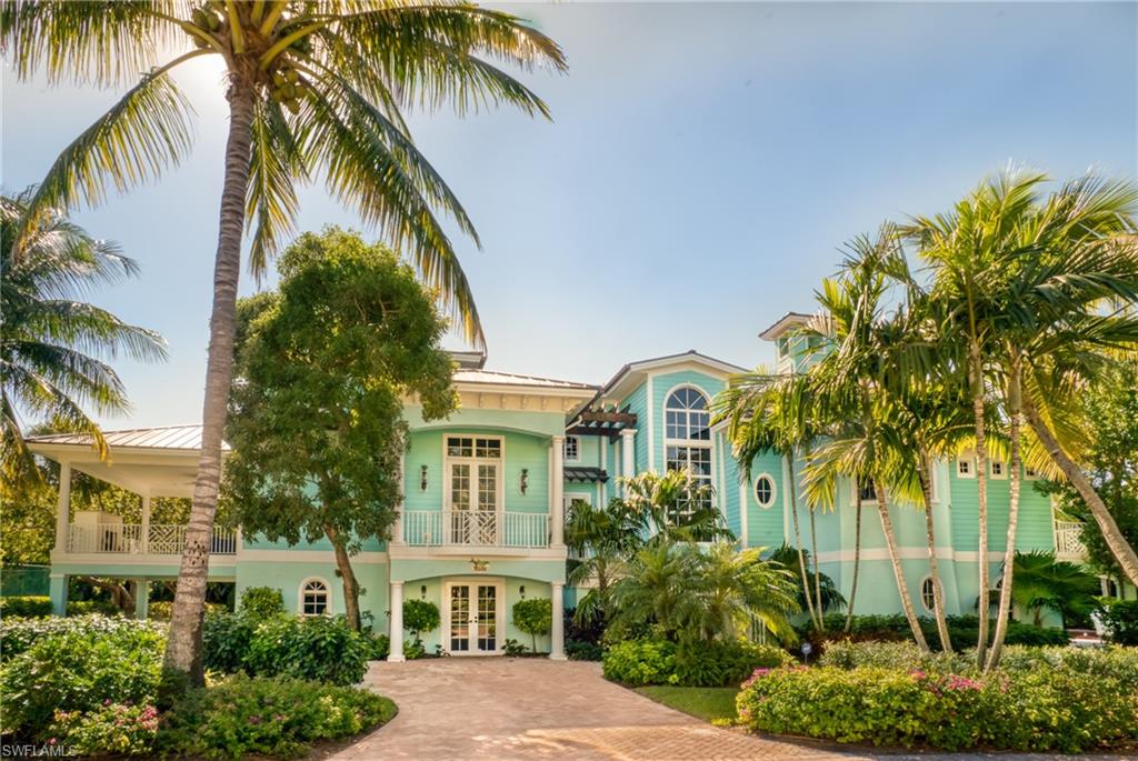 Exceptionally well constructed and beautifully maintained, this home is the ultimate tropical oasis on over an acre with its own cascading waterfall directly across from the pristine Captiva beachfront showcasing the stunning views over the azure Gulf waters, extraordinary sunsets and deep water access with lift on Roosevelt. Among the countless benefits this home includes 5 car garage, whole home generator, 5 air conditioners and a billiard room with expansive bayside deck featuring an outdoor fireplace. The pleasing tropical color scheme flows beautifully throughout and the appointments are outstanding with superb attention to detail. Built like a modern day fortress with poured concrete flooring, tie-beams and pilings. If you have been searching for a gulf front home with boating access, newer construction and the amenities of a resort, you have arrived. Furnishing negotiable.