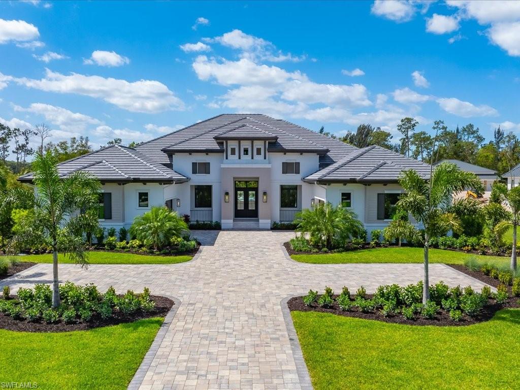 A striking expression of contemporary coastal design, 6462 Daniels Road is a newly completed estate by Stock Custom Homes, artfully designed by Soco Interiors and set across two and a half acres of coveted southern exposure in Livingston Woods. Encompassing four thousand four hundred forty-one square feet under air, this four-bedroom plus office residence offers a rare balance of architectural intention and effortless livability. From the moment you enter, the home reveals a layered, design-forward aesthetic that feels both grounded and refined. Earthy wood tones harmonize with polished chrome, light bronze, and deep iron finishes, creating a rich material palette that evolves throughout the interiors. Custom wall and ceiling details reinterpret classic coastal influences through a modern lens, while a soothing composition of soft tans, warm browns, and crisp whites is elevated by cool blues, muted greys, and striking hints of black for depth and contrast. Carefully curated, nature-inspired accessories and bold abstract artwork further enhance the home’s sophisticated character. The main living areas flow seamlessly into expansive outdoor spaces, where southern exposure provides the ideal backdrop for a future resort-style setting. The scale and privacy of the grounds allow for endless possibilities—whether envisioning a custom pool and spa, guest house, or a private retreat immersed in lush landscaping. The kitchen serves as a central gathering space, designed with both visual impact and functionality in mind, while the primary suite offers a serene escape with spa-like appointments and a calming, textural ambiance. Located just moments from Naples’ renowned dining, shopping, and beaches, this Livingston Woods estate delivers a level of design, land, and lifestyle that is increasingly rare—an opportunity that quietly stands apart from the expected.