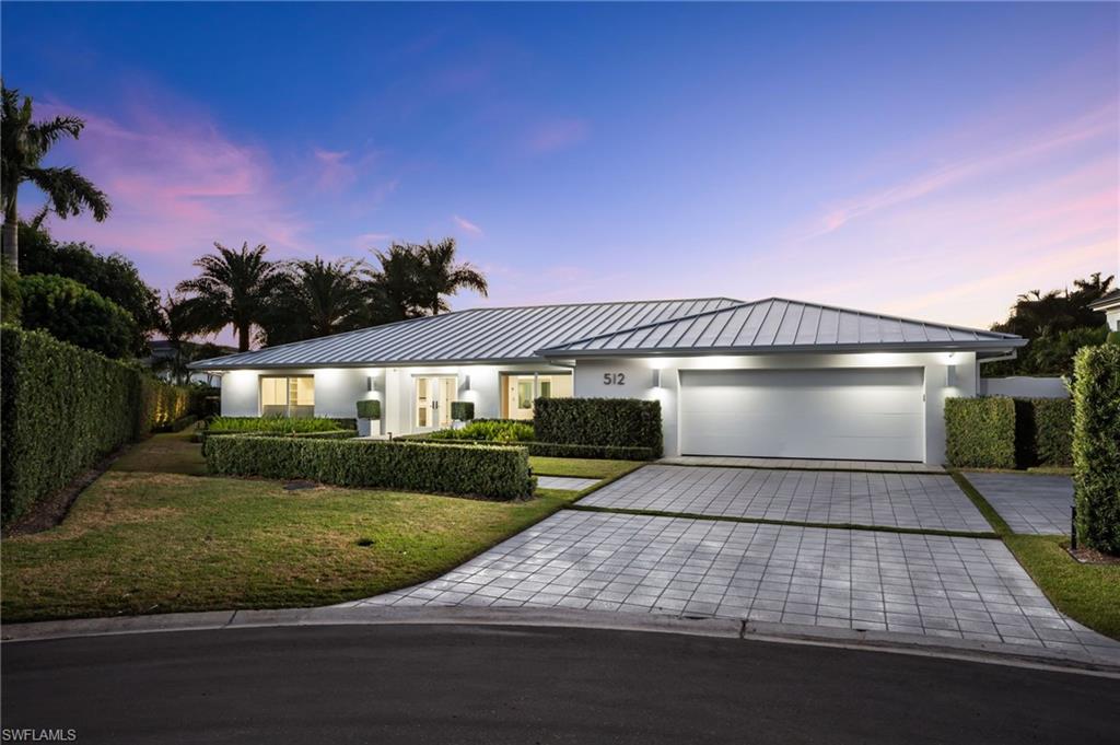 Welcome to 512 Neapolitan Lane, a luxurious single-family residence in Park Shore that showcases tasteful design and an impeccable renovation. This home is enviously positioned on an oversized lot and on the quiet cul-de-sac of a non pass through street. Exceptional craftsmanship is on display as soon as you walk through the front door. Inside, you will find a flowing layout with 3 Bedrooms, 3.5 Bathrooms, a Dining Room, a Kitchen, a Walk-In Pantry, a sizable Laundry Room, and multiple Living Areas ideal for entertaining guests. The Owner’s Retreat offers a masterfully curated bath, 2 walk-in closets, and a dressing room which could serve as a third closet, home office, or exercise room. Each of the Guest Rooms are completed by en-suite baths. The Kitchen is appointed with custom oak cabinetry, custom quartz countertops, and a Wolf appliance package. Outside, you have everything that you could desire - a covered lanai with a summer kitchen, a modern pool and spa featuring a full swim lane, and a spacious, private side courtyard complemented by a cozy fire pit. Additional features and comforts include impact resistant doors & windows, automated window coverings, built-in speakers, LED lighting, a generator, and more. Enjoy the Park Shore Association’s private beach access and close proximity to social hubs such as the Village Shops on Venetian Bay & Waterside Shops.
