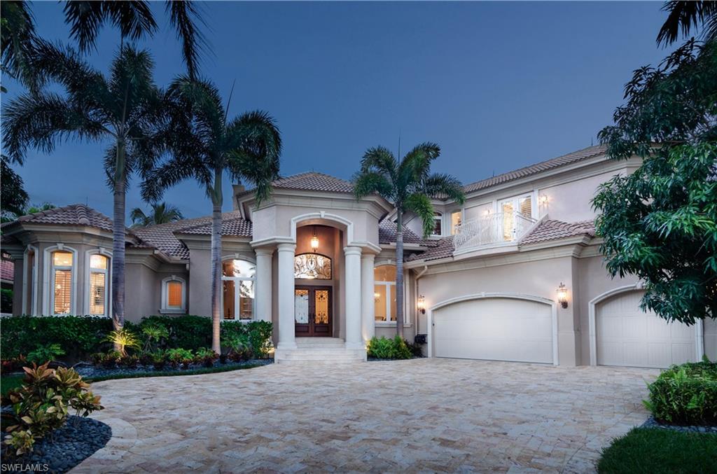 An amazing waterfront home with a spectacular view looking all the way down the intersecting canals with a short boat ride to the gulf or walk to 3rd St for drinks & dinner.  This home has been impeccably maintained & exudes quality.  A stone fireplace flanks the living room with a wall of sliding glass doors overlooking the water.  Wet bar with two wine coolers and ice machine.  Clive Christian cabinets in kitchen & entire home, Wolf range with custom hood, 2 sub zero refrigerators, massive custom island with 2 Miele dishwashers.  Negative edge pool & spa, summer kitchen with sink, refrigerator & Lynx BBQ Grill.  Large IPE wood dock with 2 boat docks, 2 boat lifts & boat storage garage.  Gorgeous view of the water in the Master, jetted tub, bidet & large shower.  3 car oversized garage, open floor plan with high ceilings & light filled rooms. This home was extensively renovated in 2007.  Upgrades include a new roof, lightning protection, impact glass windows, exterior security cameras, extensive moldings, electric storm shutters, salt water pool & spa and gated entry. In 2018 the upgrades include new pool tile, pool heat pump, epoxy garage floor, new drapes and paint throughout.