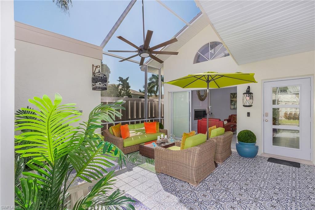 Walk into your vacation/Dream Home w/1.5-story brand new screened courtyard provides year around outdoor space w/Moroccan styled tile on the outside Lani. Walk into the open floor plan w/3-bedrooms 2 bathrooms completely renovated with a Carrara marble tile thru-out the main level. The living is easy in this impressive 1.5-story vaulted ceiling living space w/recessed lighting and floor to ceiling butane fireplace. In the rear of the home is the completely renovated kitchen with white soft closed cabinetry, stainless-steel GE profile appliance package and quartz counters w/ white tiled backsplash. The Owner's suite is located on the 1st floor with overside walk-in closet w/new closet system and full bath and laundry. The 2nd floor has 2 large bedrooms w/walk-in closets one of the bedrooms has a private balcony overlooking the greenspace. On this level is a full bathroom w/tiled shower. This home is located near whole foods, restaurants, Walgreens, Publix, 20-30 mins to ft Myers Beach, Sanibel island and downtown.