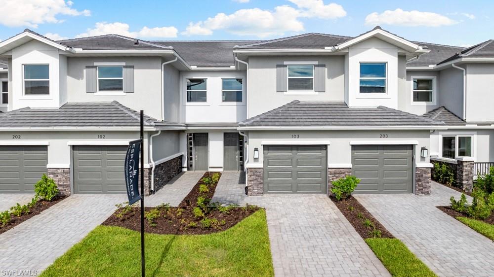 What's Special: Lake View | Gourmet Kitchen | Premium Location | Walk-in Closets | Covered Lanai. New Construction - Ready Now! Built by America's Most Trusted Home Builder. Welcome to the Vitale at 15340 Giardino Drive Unit 103 in Esplanade by the Islands Coach Homes! This thoughtfully designed home offers inviting spaces created for everyday comfort and connection. The open kitchen flows seamlessly into the dining area and expansive gathering room, creating the perfect setting for entertaining guests or enjoying a quiet evening at home. The private primary suite features a spacious bath and generous storage, while the secondary bedroom and bath provide flexibility for visitors, hobbies, or a home office. A large covered lanai extends the living space outdoors, offering a relaxing place to enjoy Arizona's beautiful weather. A garage and a convenient laundry room add functionality to this well-balanced floor plan. Additional Highlights Include: impact windows throughout the whole house, tray ceiling package, fireplace, quartz countertops, Café kitchen appliances, and upgraded laminate flooring. Photos are for representative purposes only. MLS#226025363 - Esplanade by the Islands Coach Homes offers an unparalleled lifestyle with resort-style amenities and wellness programs to inspire and invigorate. Whether you’re seeking active adventures or peaceful retreats, this community delivers luxury and sophistication at every turn. Swim laps or lounge by the resort-style pool, sip a refreshing drink at the Bahama Bar, or recharge at the state-of-the-art wellness center. Stay energized with tennis, pickleball, and bocce courts, or indulge in unique experiences like wine tastings, cooking classes, and live concerts. The culinary center provides both fine and casual dining, along with opportunities to hone your cooking skills. From relaxing spa events to exciting excursions, Esplanade by the Islands makes every day a celebration of vibrant, carefree living.