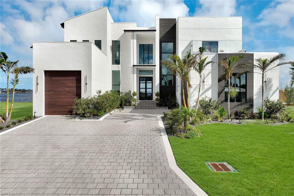 Worldbid Auction –  STARTING BID: $3,595,000
PRE AUCTION OFFERS DUE NOW THRU July 9, 2026, AUCTION BIDS DUE July 16 to July 22, 2026 NOON ET.  AUCTION BIDDING: Your sealed bid must be submitted on the Premiere Estates sealed-bid auction purchase contract.  Qualifying round bids must be submitted July 16 to July 23, 12:00 PM ET

New Construction, riverfront property. 5 bed, 8 bath, family room, game room, office, additional butler kitchen, and a glass cube elevator. This High-end project from Exclusive Designs features a contemporary design and an open floor plan. Impact-resistant windows and doors throughout bask the spacious living area in natural light from endless riverfront views. Two iPad stations on each floor provide full automatization of the house, pool, home lights, appliances, and environmental controls. The main kitchen is equipped with Cambria quartz countertops, Dacor appliances, custom all-wood cabinets, and automated cabinet openers. Additional buttler kitchen is fully equipped with Cafe smart appliances. Furthermore, the owner's master bedroom, powder room, glass cube elevator, and office can be found on the ground floor. Upstairs consists of. The second master bedroom boasts front and back-of-the-house walk-out terraces, walk-in closets, and an enormous master bathroom. Additional two guest bedrooms with dedicated bathrooms and walk-in closets. The second floor culminates in a spacious loft with an expensive riverfront view. Outdoor Living, indoor and outdoor merge through 54 feet of the glass wall and access through 20 foot-wide sliding door. Lanai is finished in marble pavers with a sand finish. The summer kitchen includes a Blaze 40" BBQ, a drinks cooler, and an ice maker. The pool and the jacuzzi are saltwater system equipped and heated. In addition, there is a pool bathroom and an outdoor shower for ease of entertainment. LP countersunk firepit at the side of the pool will provide a perfect evening at the end of the day. The property sits on the Caloosahatchee River providing navigable access to the Gulf of America. Cape Coral downtown with its amenities is just 2 miles away and the Tarpon Point Marina with its restaurants is just a mile from the house. All can be reached with a street-legal 6-person golf cart included with the house.