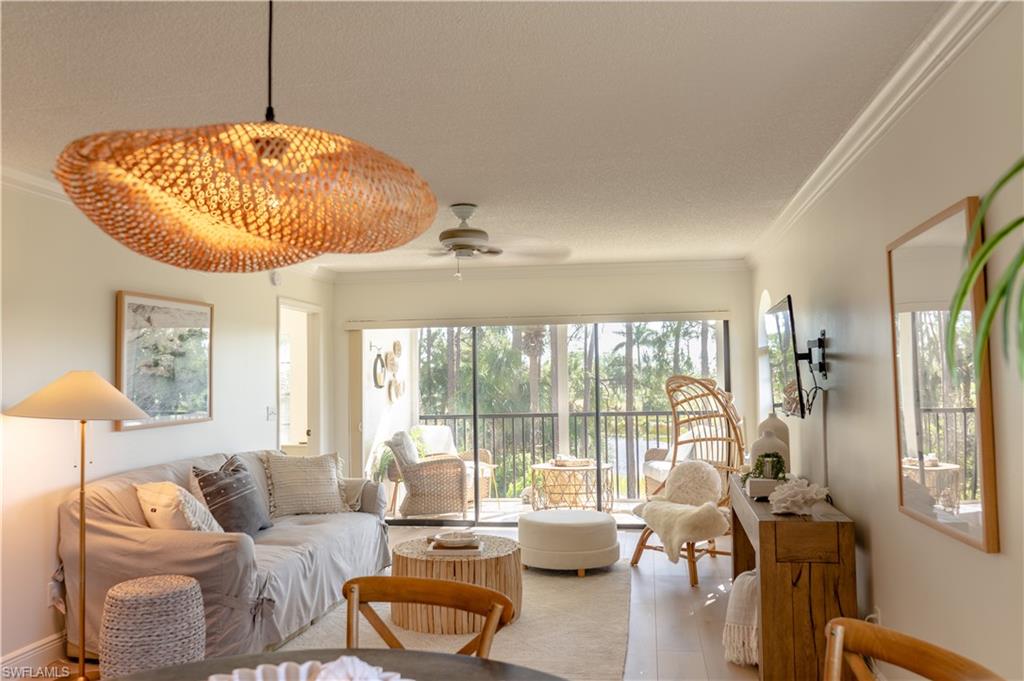 Welcome to 265 Deerwood Circle #10, a beautifully updated second-floor end-unit condominium in the peaceful Gleneagles community of Lely Golf Estates in Naples. This well-appointed 2-bedroom, 2-bath residence offers over 1150+ square feet of living space with a desirable split floor plan that provides privacy and comfort. The interior features an updated kitchen and bathrooms with quartz countertops, modern finishes, and abundant natural light throughout. Enjoy tranquil views from the screened lanai overlooking the lake, lush landscaping, and the Royal Palm Golf Course, creating a serene Southwest Florida setting. Residents of Gleneagles enjoy a quiet, well-maintained community with access to a heated pool and spa, clubhouse, and beautifully landscaped walking areas. The community is adjacent to public golf courses (no mandatory membership), offering convenient access to golfing without bundled golf fees. Covered parking and additional storage are included. Ideally located just minutes from downtown Naples, 5th Avenue South, Marco Island, beaches, dining, shopping, and healthcare facilities, this property is perfect for seasonal or full-time living.