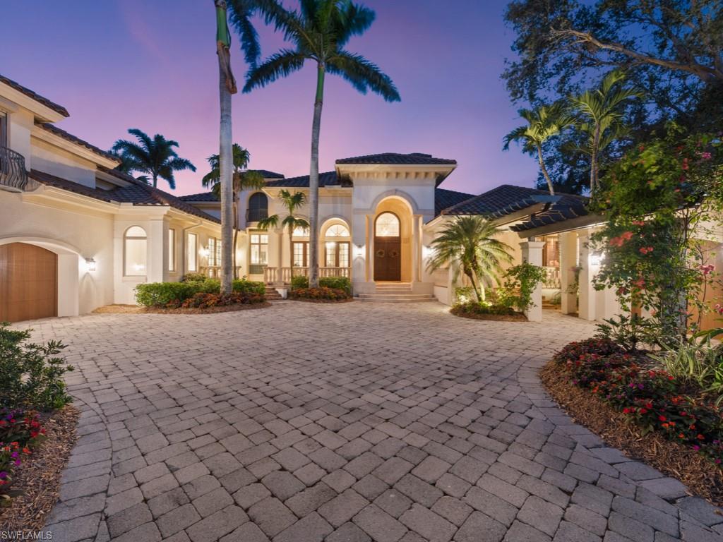 Timeless Harwick/Collins & DuPont custom designed home on prominent corner lot in desirable Spring Ridge with gorgeous lake views.  Through the grand entrance, one sees amazing high ceiling treatments, warm and inviting décor, included in the price, and the incredible tropical lagoon pool with a separate waterfall gently flowing into it.  Approximately 6,900 sq ft under air.  Outdoor kitchen/grilling area, fireplace, tons of covered seating make this outdoor area one of a kind. Stunning family room. 5 bedrooms, en suite, plus a handsome private study with morning kitchen, 5 full bathrooms and one-half bath.  Second smaller office. Kitchen remodeled, new roof, new A/C’s and screen enclosure all in past 3 years.  Outdoor pet area and fountain/sitting areas.  Great storage areas and large pantry.  Full hurricane protection, including impact sliders. This home must be seen to be appreciated. Enjoy the total lifestyle that not only this home offers, but Bonita Bay w/5 golf courses, private beach, marina, sports/racquet center w/ resort-style pool, lifestyle center w/ state-of-the-art fitness facility, luxury spa and salon, plus miles of walking & biking trails, & 3 parks.