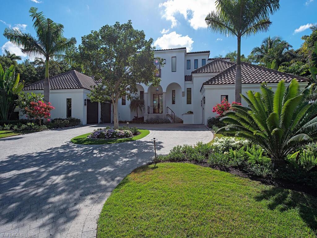 Situated in prestigious Port Royal on the tranquil waters of Lantern Lake, this exceptional decorator  furnished residence offers a rare blend of architectural refinement, privacy, and waterfront living. A dramatic south-facing wall of glass sliding doors, pocket and disappear, to frame serene lake views while overlooking the pool and spa, filling the home with natural light and creating a seamless connection between indoor and outdoor spaces.

The home was renovated with a complete interior and exterior transformation, expertly executed by Lisa Kahn Designs in collaboration with Monarch Builders. Highlights include beautiful hardwood flooring throughout, custom Ruffino cabinetry, a striking crystal-cut custom chandelier anchoring the great room, and a thoughtfully designed layout ideal for both everyday living and entertaining.

The chef’s kitchen is outfitted with top-tier appliances, including Sub-Zero and WOLF, while modern upgrades such as a new HVAC system, screens and shutters on the newly redesigned lanai, and a brand-new whole-house generator provide comfort and peace of mind. The outdoor living areas are complemented by all-new landscaping, completely reimagined by Scott Wyndham’s Landscape Architecture, creating a private, resort-style setting. Some furnishings may have changed. 

This property includes immediate Port Royal Club eligibility, offering access to the highly anticipated new $100M clubhouse, scheduled for completion in summer 2026. Planned amenities include beachfront dining, a poolside restaurant, multiple indoor and outdoor bar areas, private cabanas, and breathtaking Gulf views from the main-level dining venues.

Conveniently located just minutes from 3rd Street South and 5th Avenue South, residents enjoy easy access to fine dining, world-class shopping, entertainment, and Naples’ renowned white sand beaches.